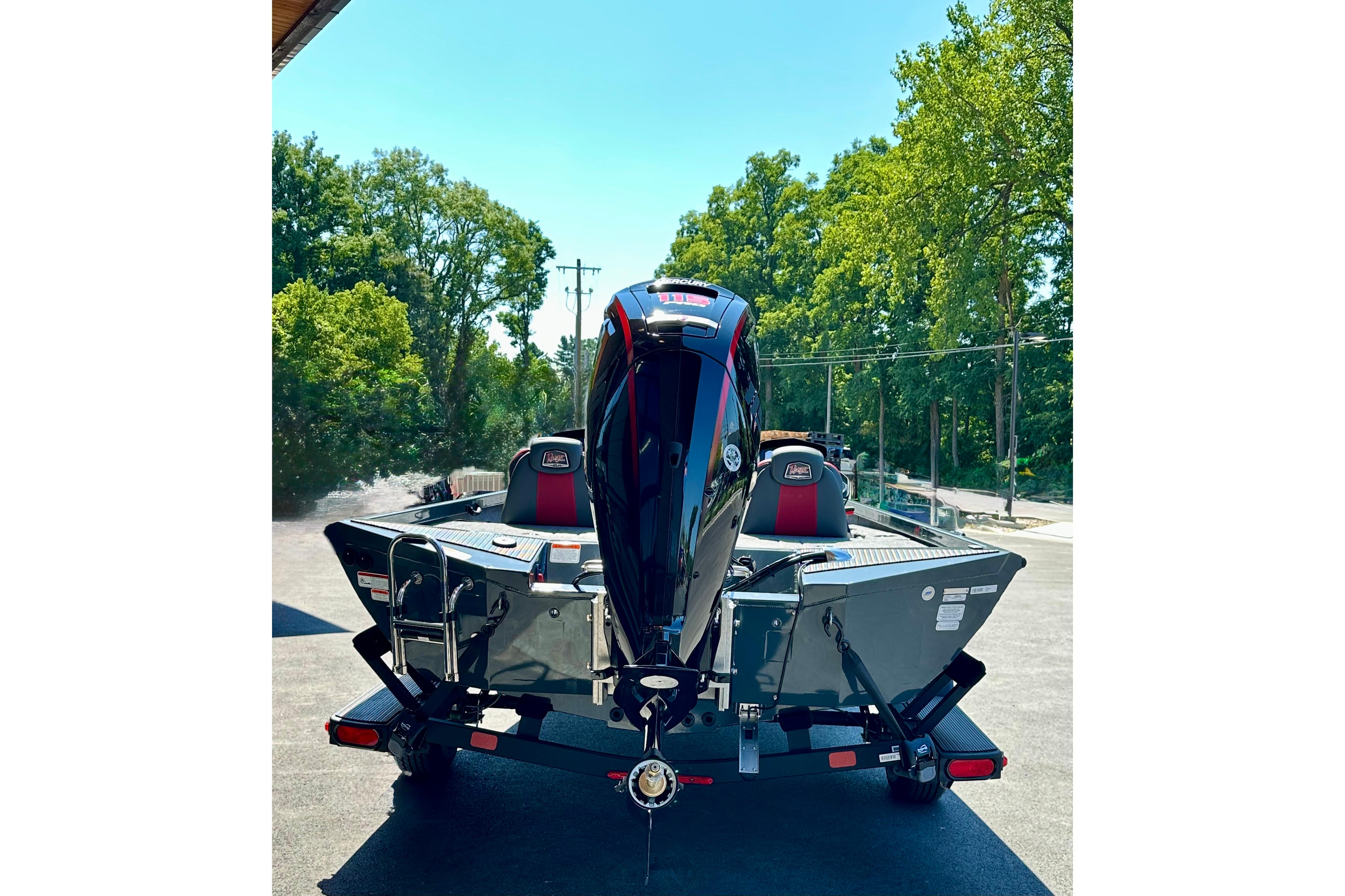 2026 Ranger RT188P boat with powerful outboard motor, parked outdoors.