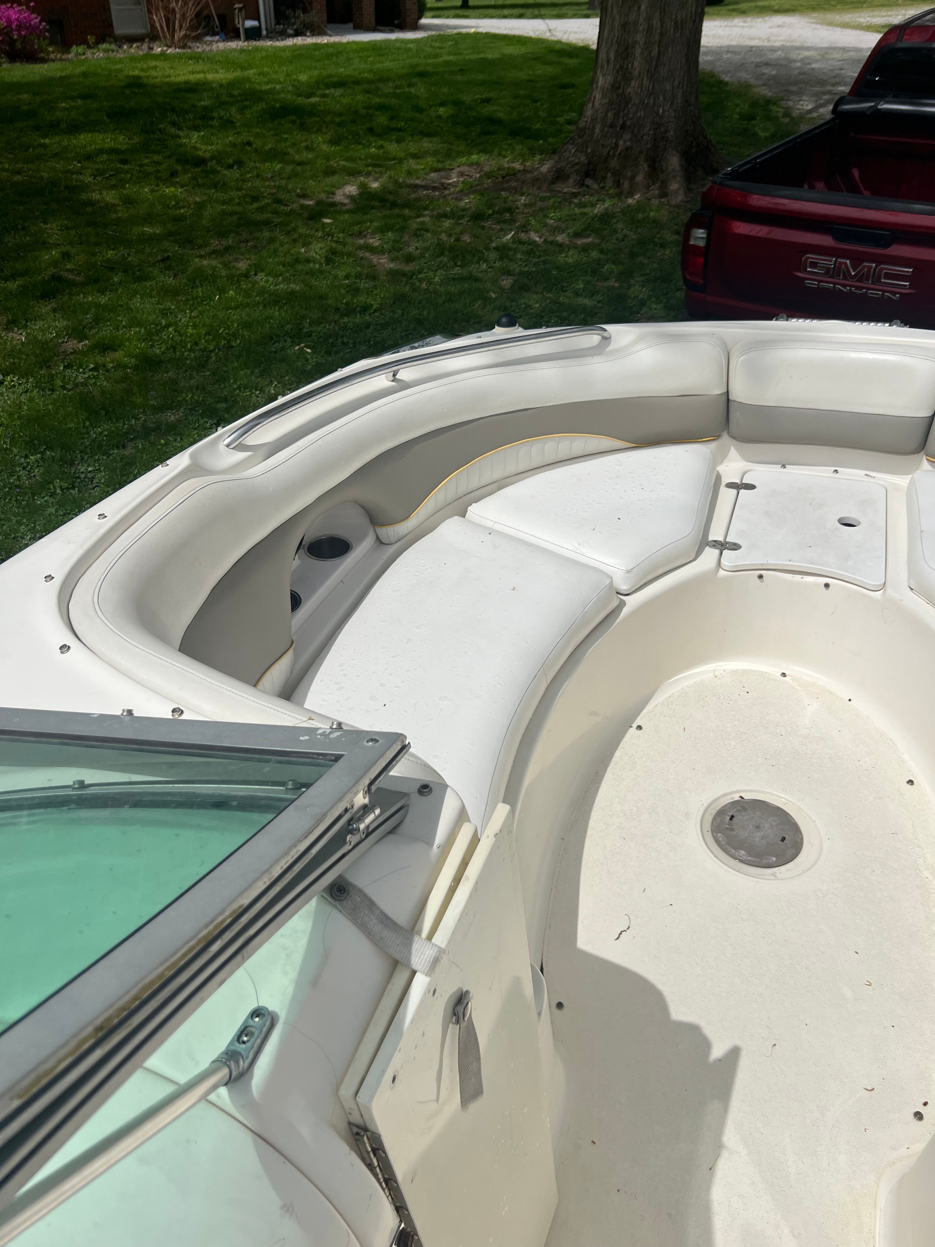 2007 Harris-Kayot S245 boat with seating area and glass window.