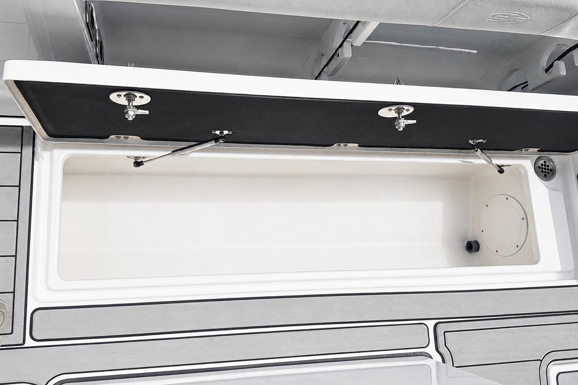 Open storage compartment on a 2002 Sea Fox 228 Commander boat.