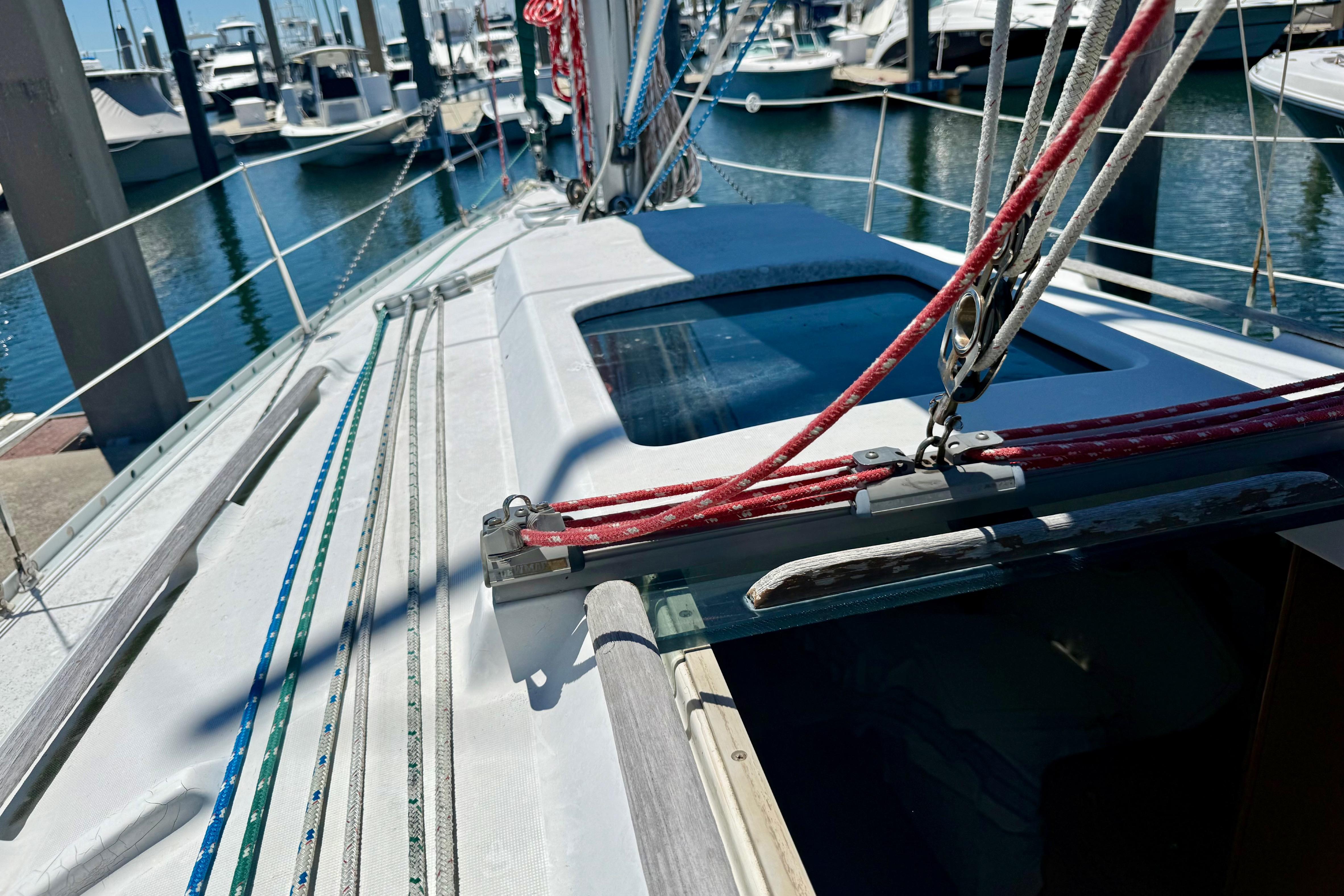 Beneteau Oceanis Clipper 311 sailboat deck, 2002 model, docked at marina.