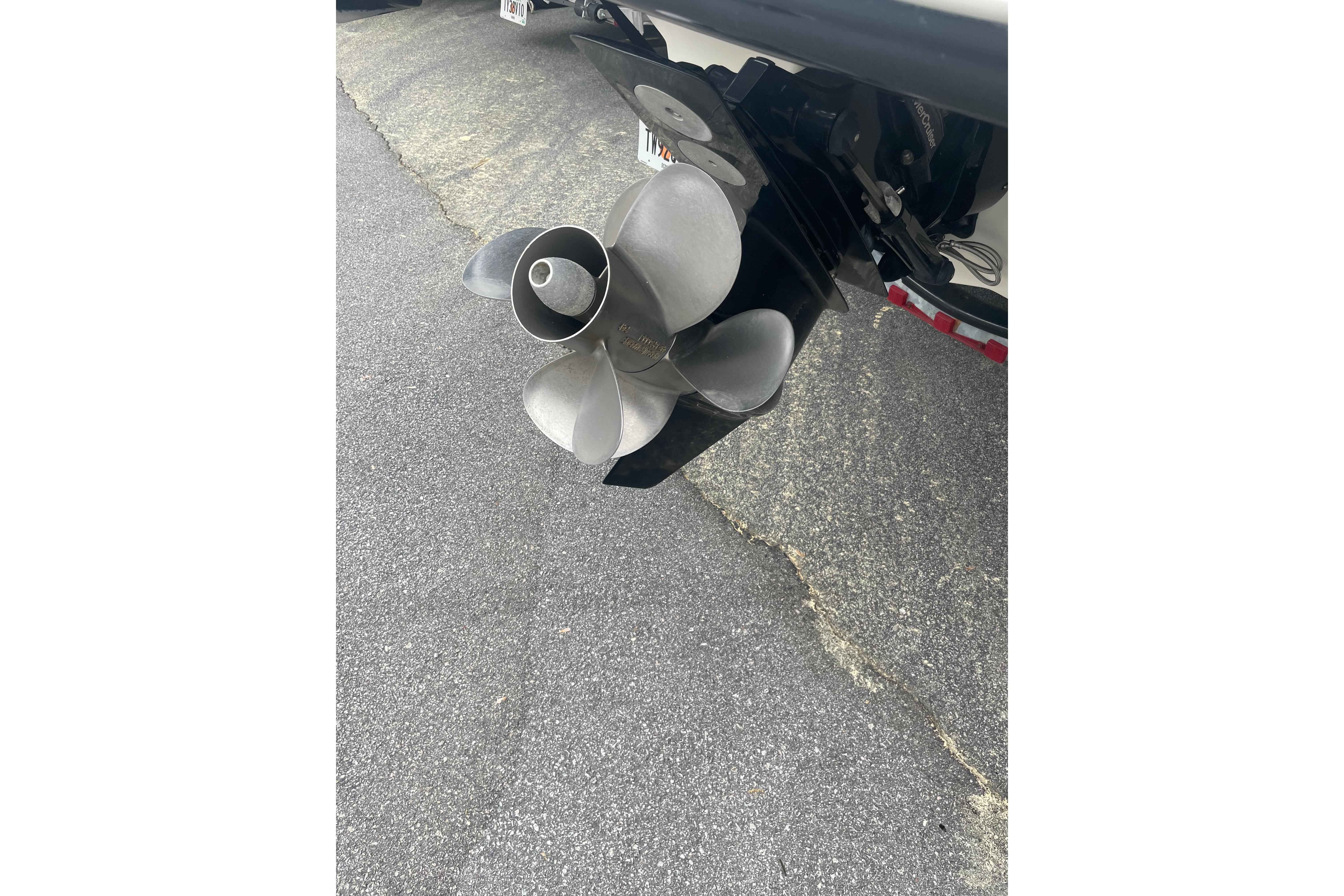 Propeller of a 2007 Sea Ray 220 Select boat on pavement.