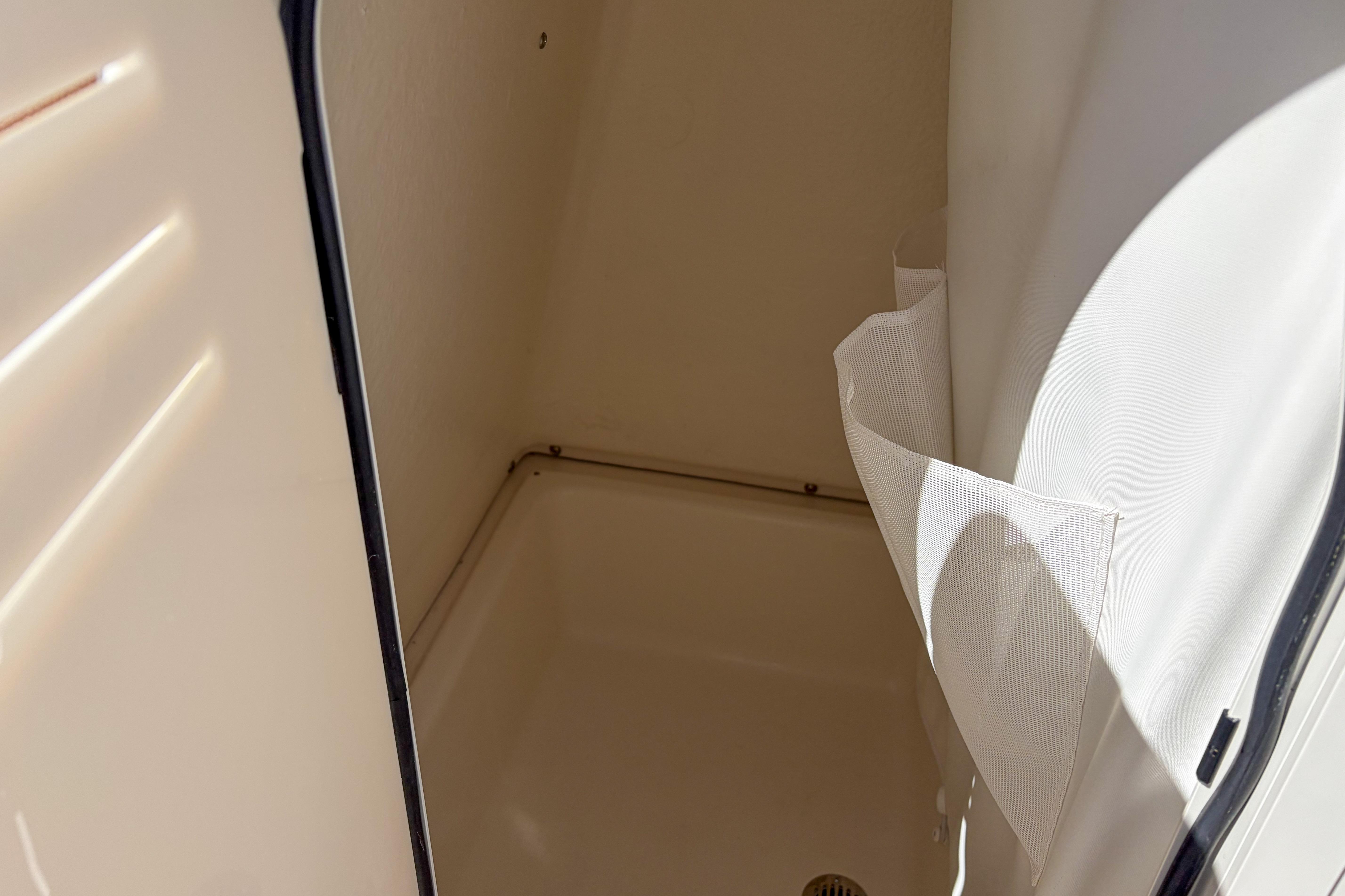Interior compartment of 2026 Pioneer 220 Bay Sport boat, featuring storage space.