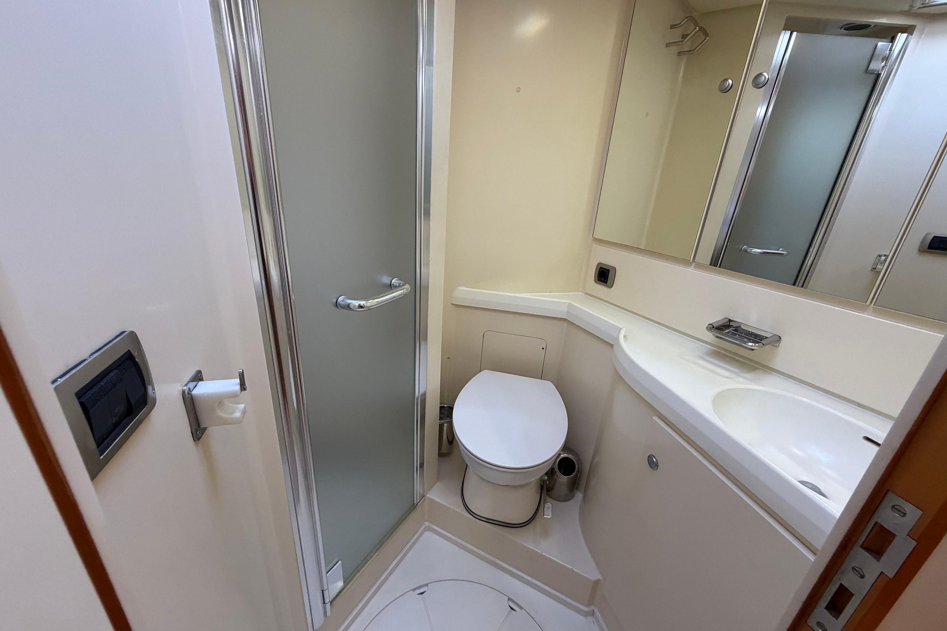 Bathroom interior of 2000 De Gier Custom Finot 60 DS Alu yacht, featuring shower and toilet.