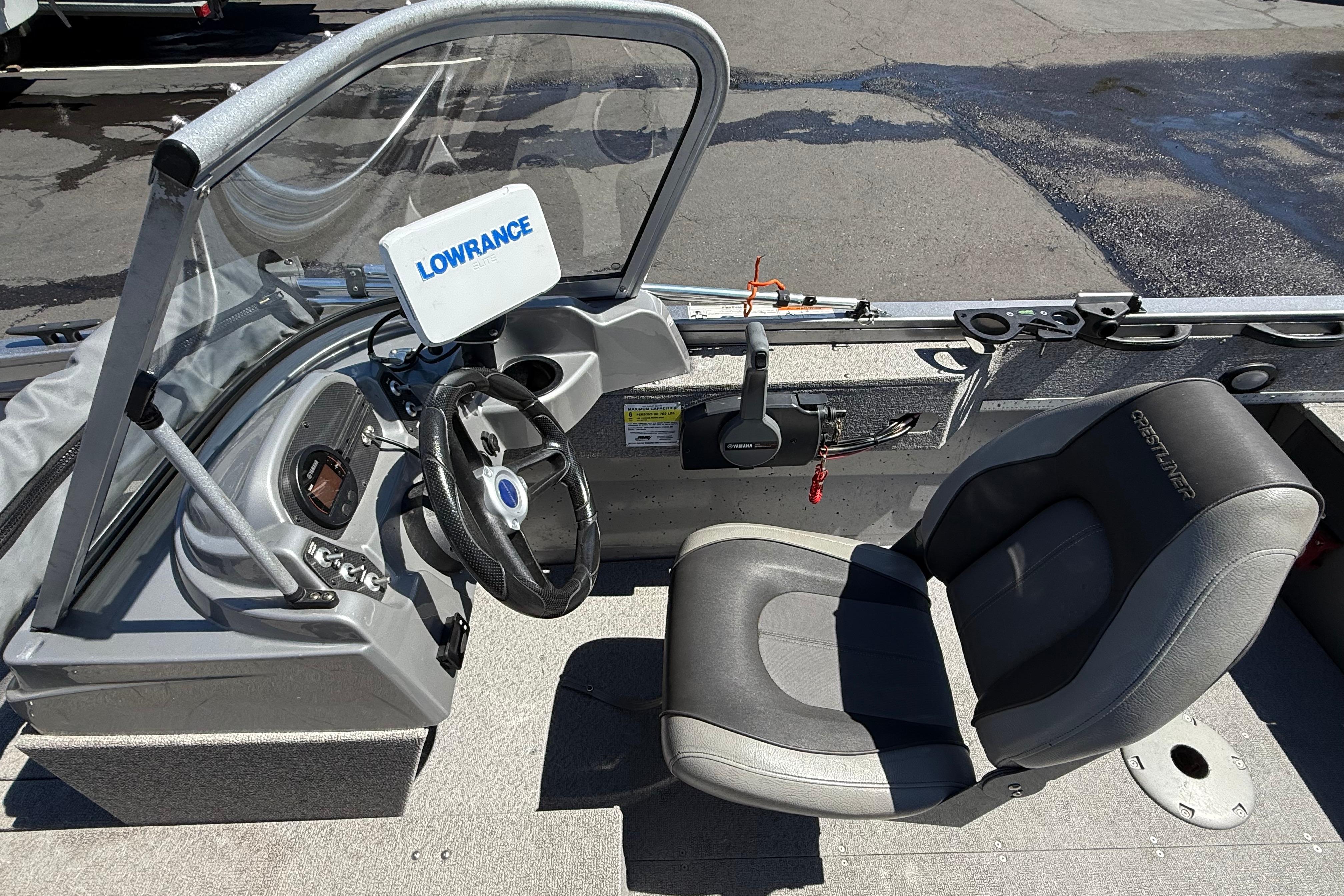 2016 Crestliner 1700 Vision boat interior with steering wheel and Lowrance device.