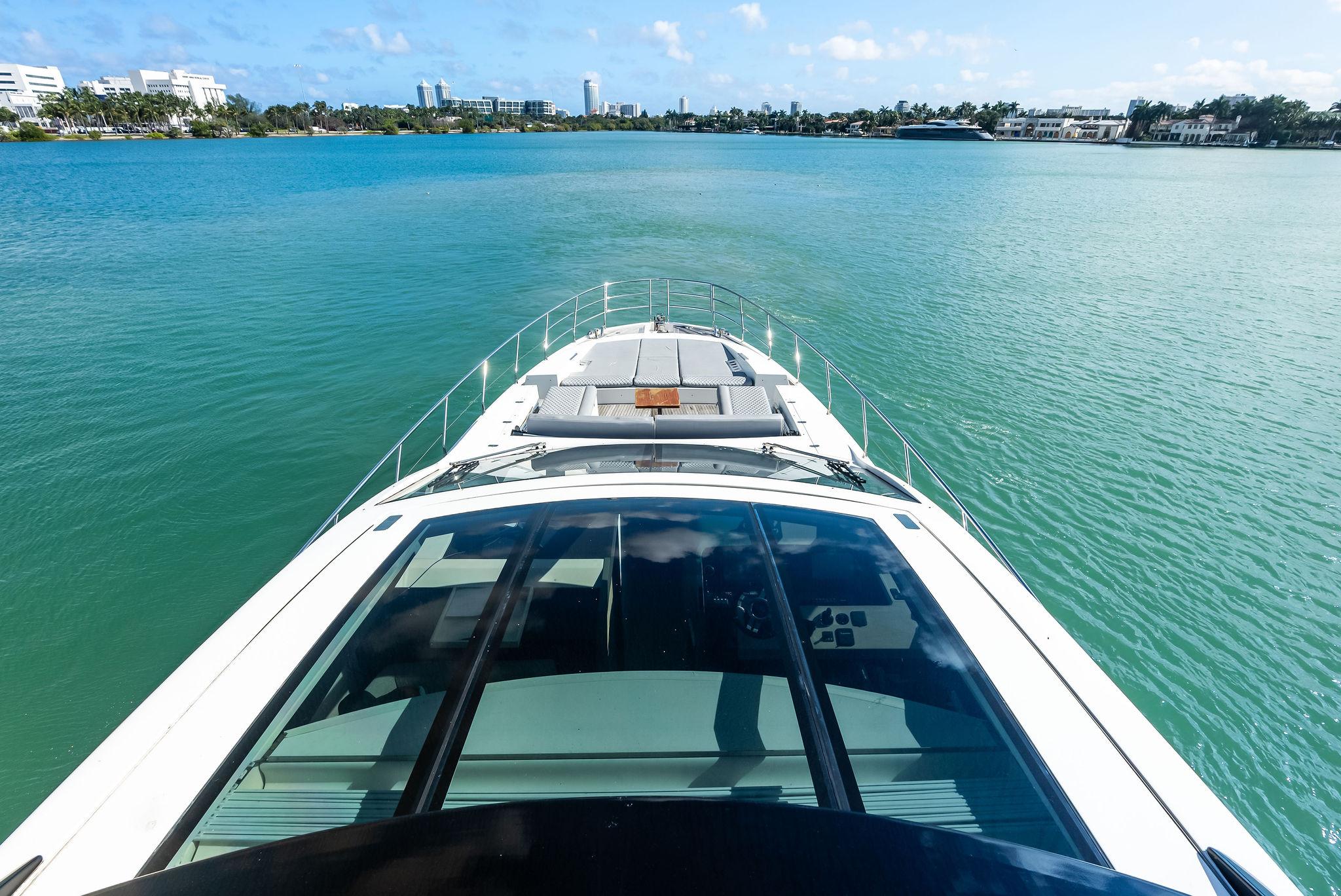 Azimut 77S 2017 yacht cruising on a serene blue waterway.