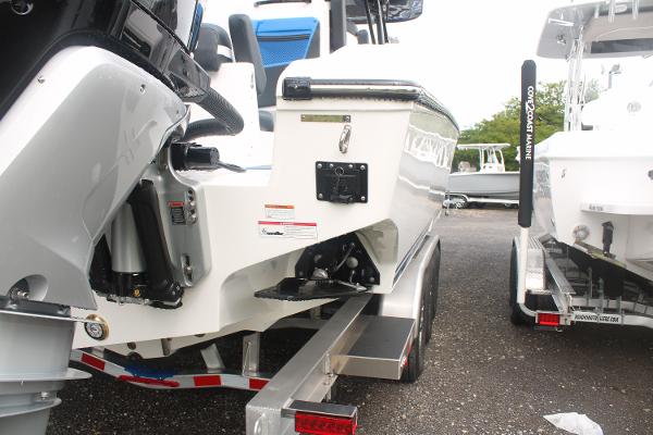 2024 Fountain 34 SC boat on trailer, rear view showing engine and hull details.