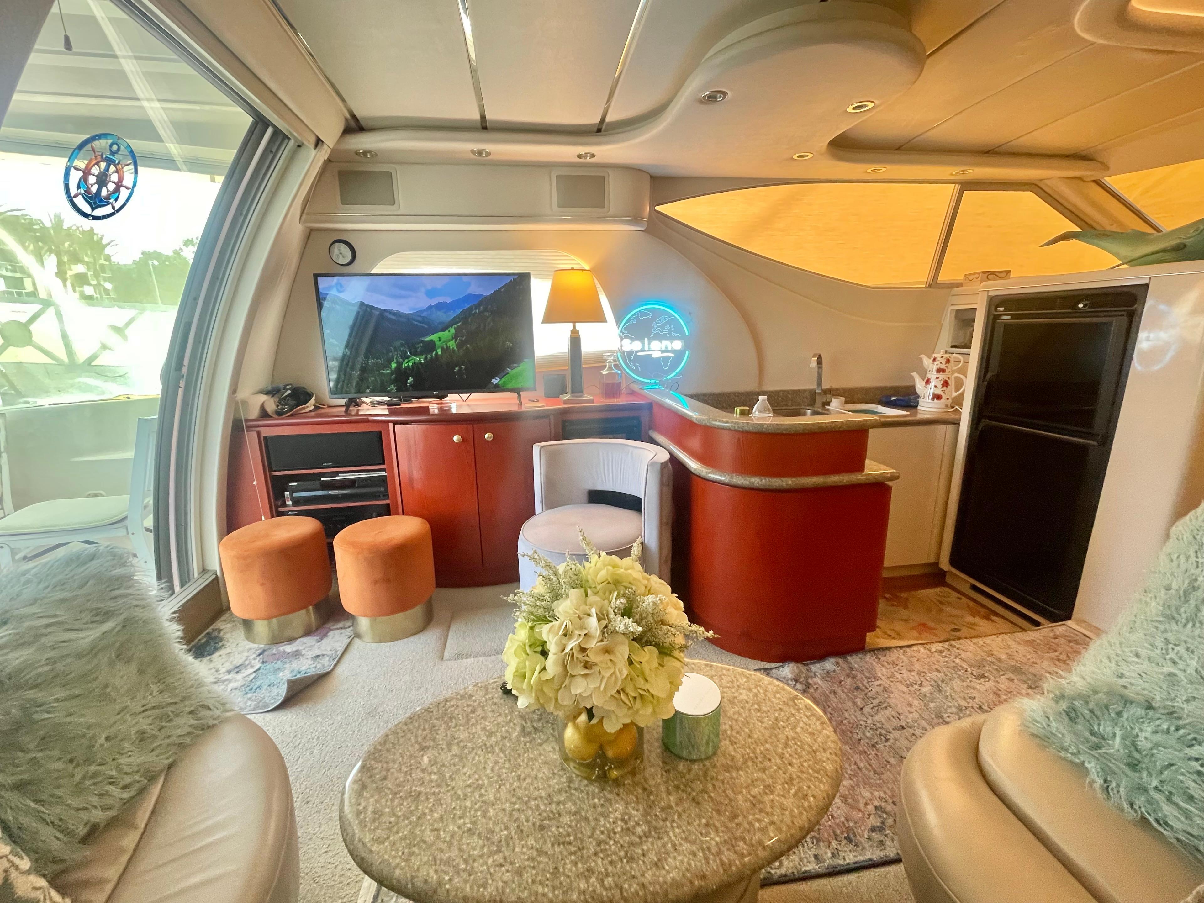 Luxurious interior of a 1998 Maxum 4100 SCA yacht with modern amenities and elegant decor.