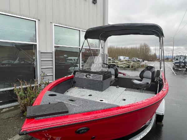 2021 Crestliner 1650 Fish Hawk SC boat, red exterior, parked outdoors.