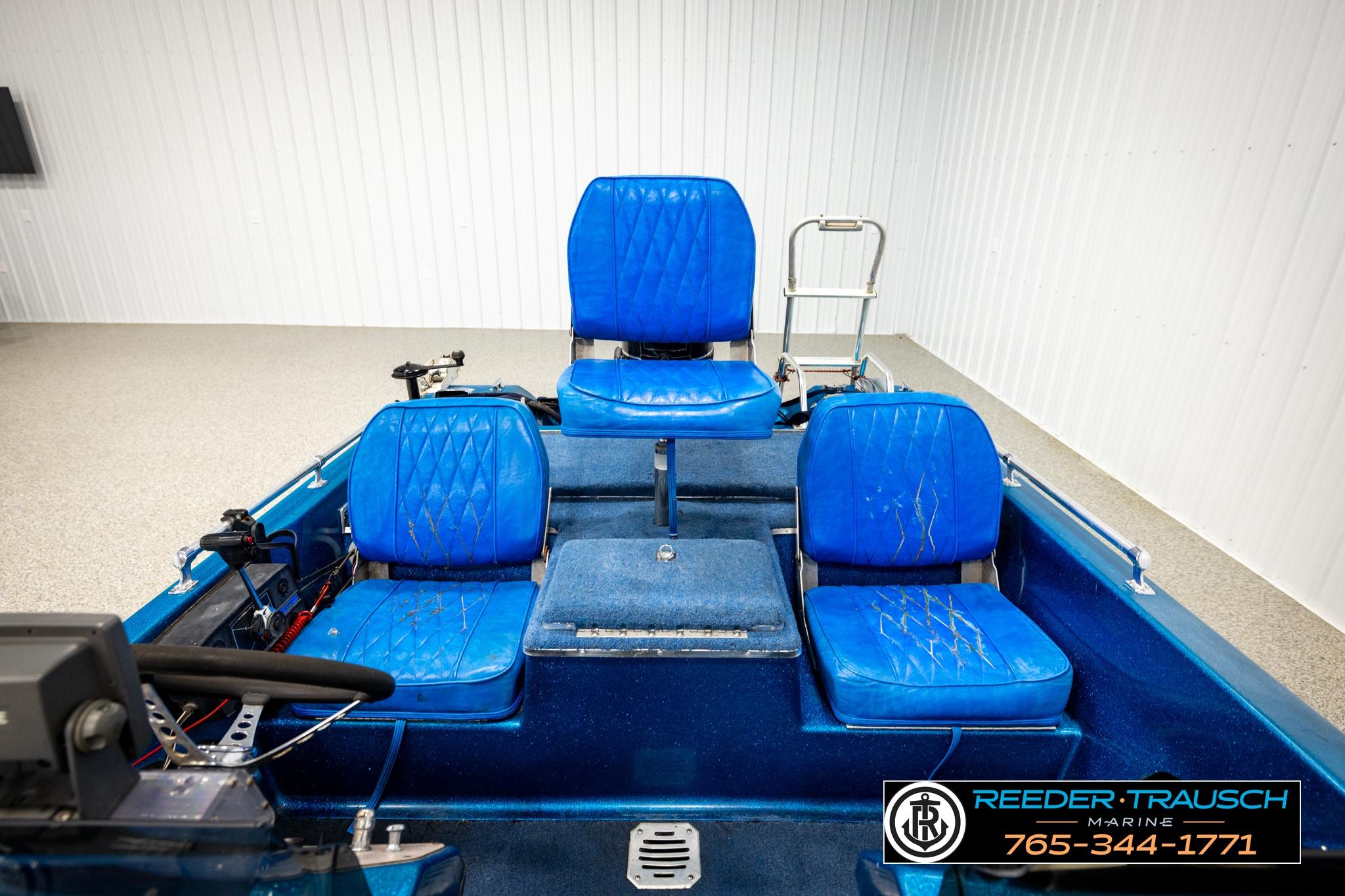 1980 Ranger 175 VS boat interior with blue seats and steering console.