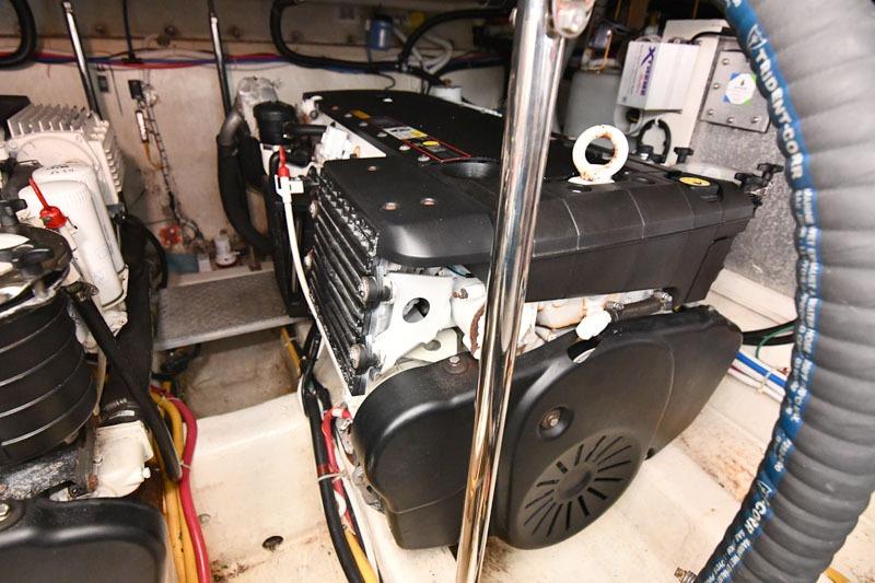 Engine room of a 2008 Carver 43 Super Sport yacht, showcasing mechanical components.