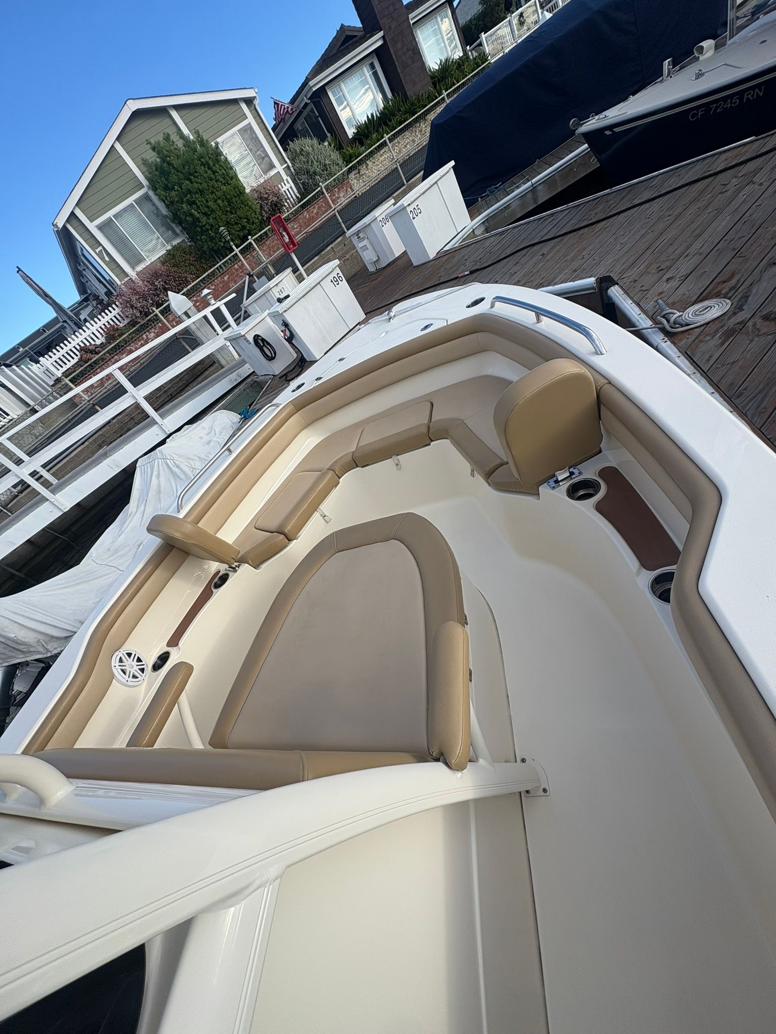 Scout 215 XSF 2020 boat with beige interior at dock.