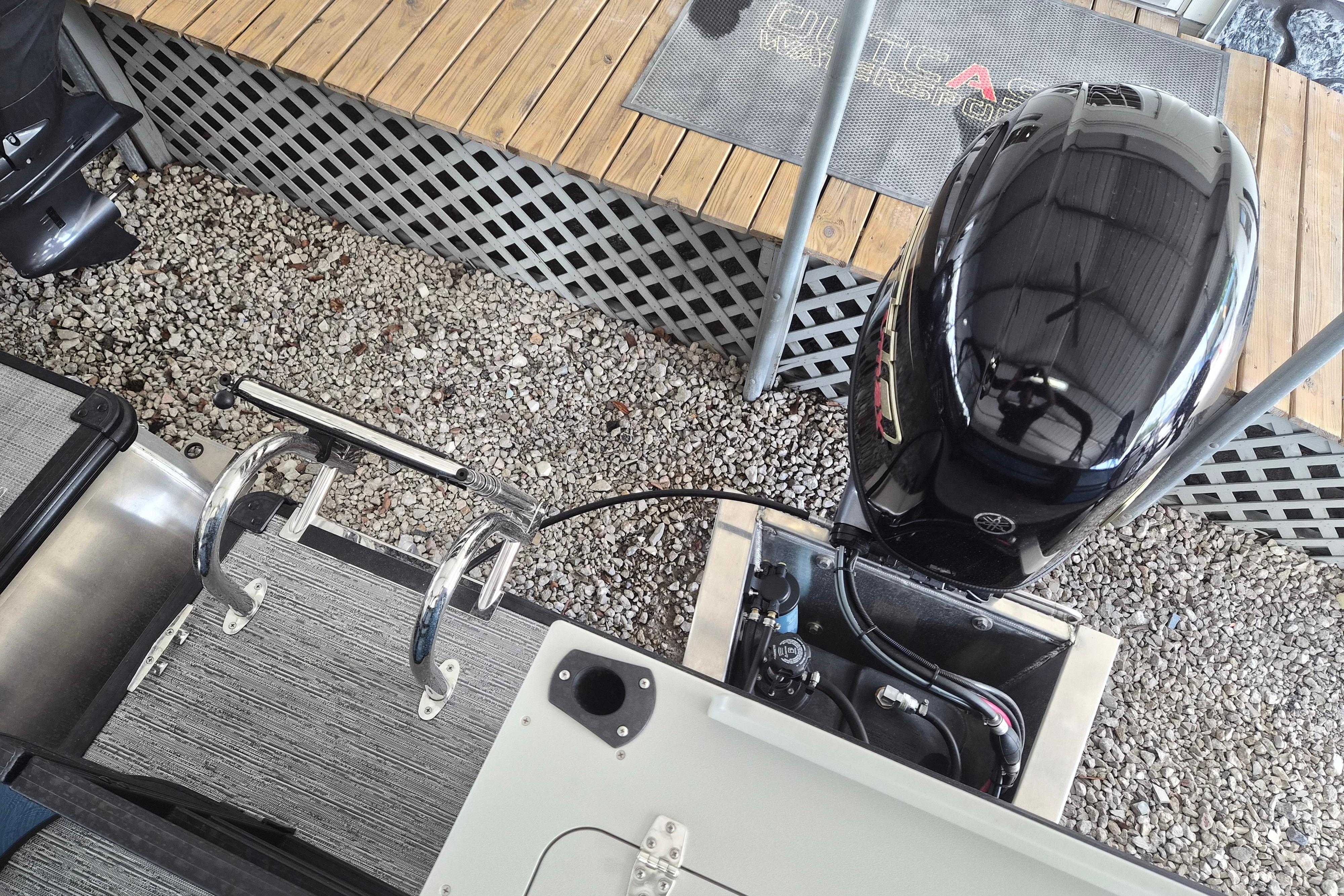 2026 Sylvan Mirage Fish 820 Party Fish boat engine and deck view.