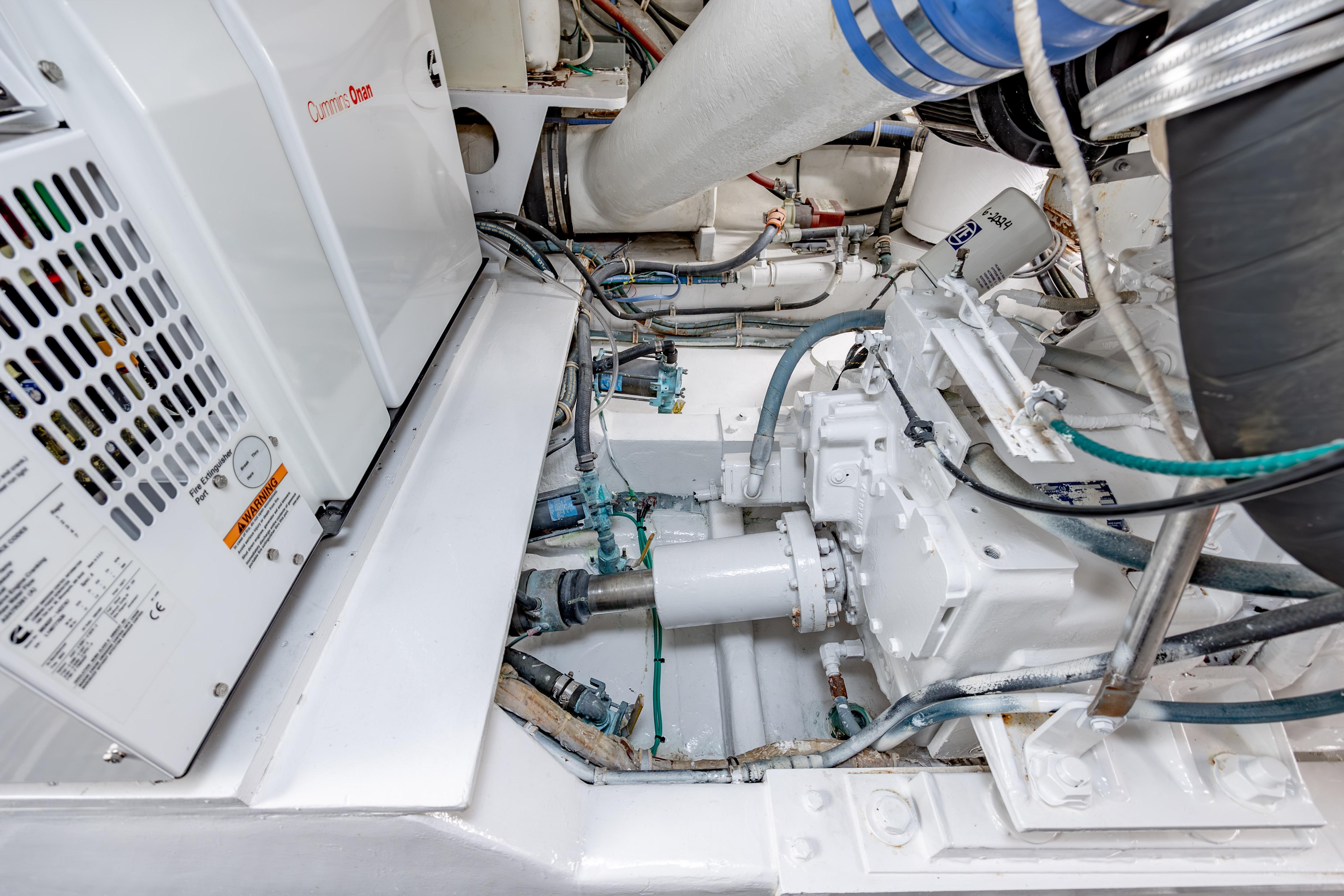 Engine room of 2000 Hatteras 50 Convertible yacht, featuring Cummins Onan generator.