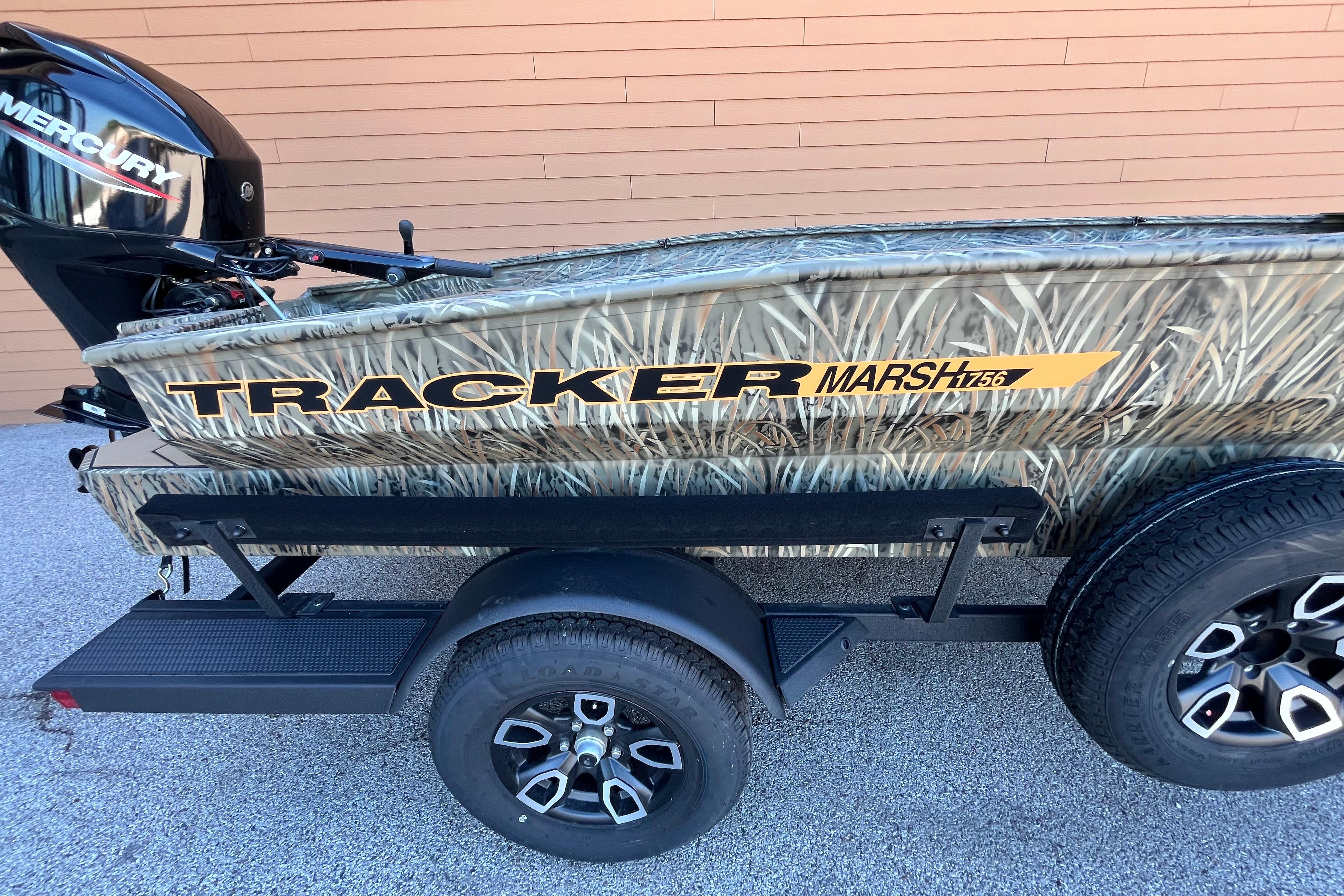 2026 Tracker Grizzly 1756 T Marsh boat with camouflage design on trailer.