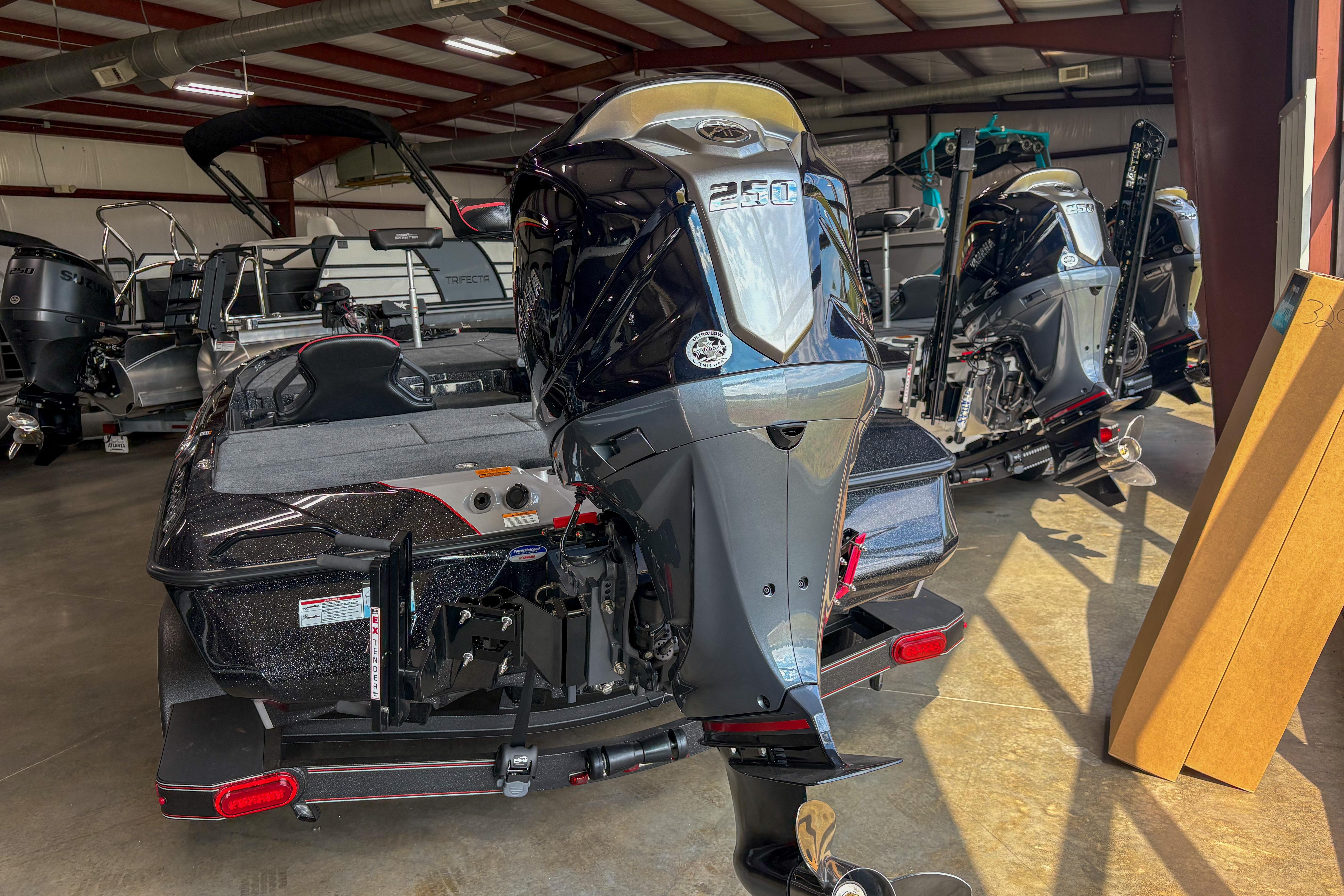 2026 Skeeter ZXE20 boat with powerful outboard motor in showroom.