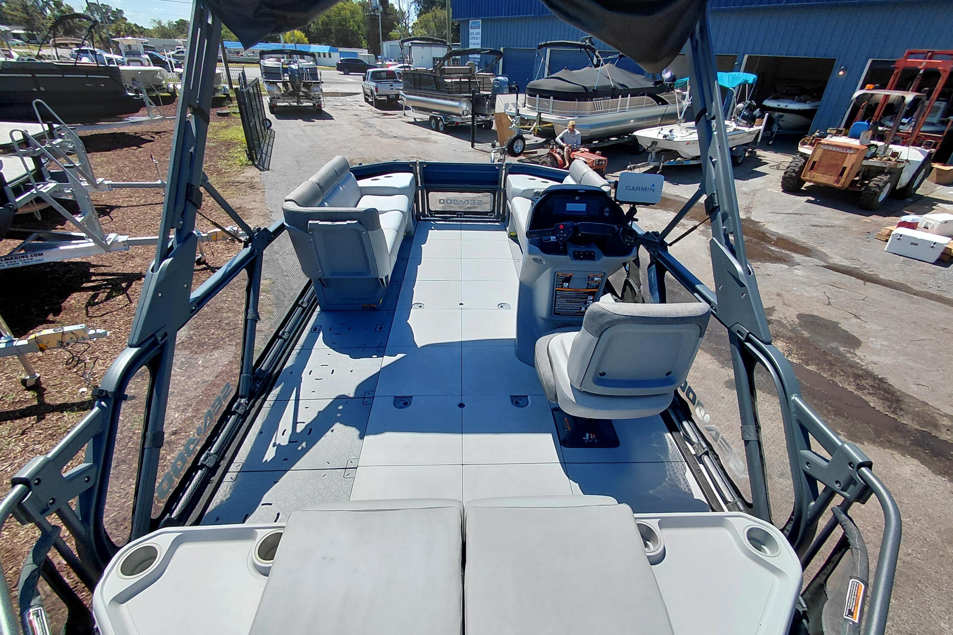 2024 Sea-Doo Switch Cruise 18 pontoon boat interior with seating and steering console.