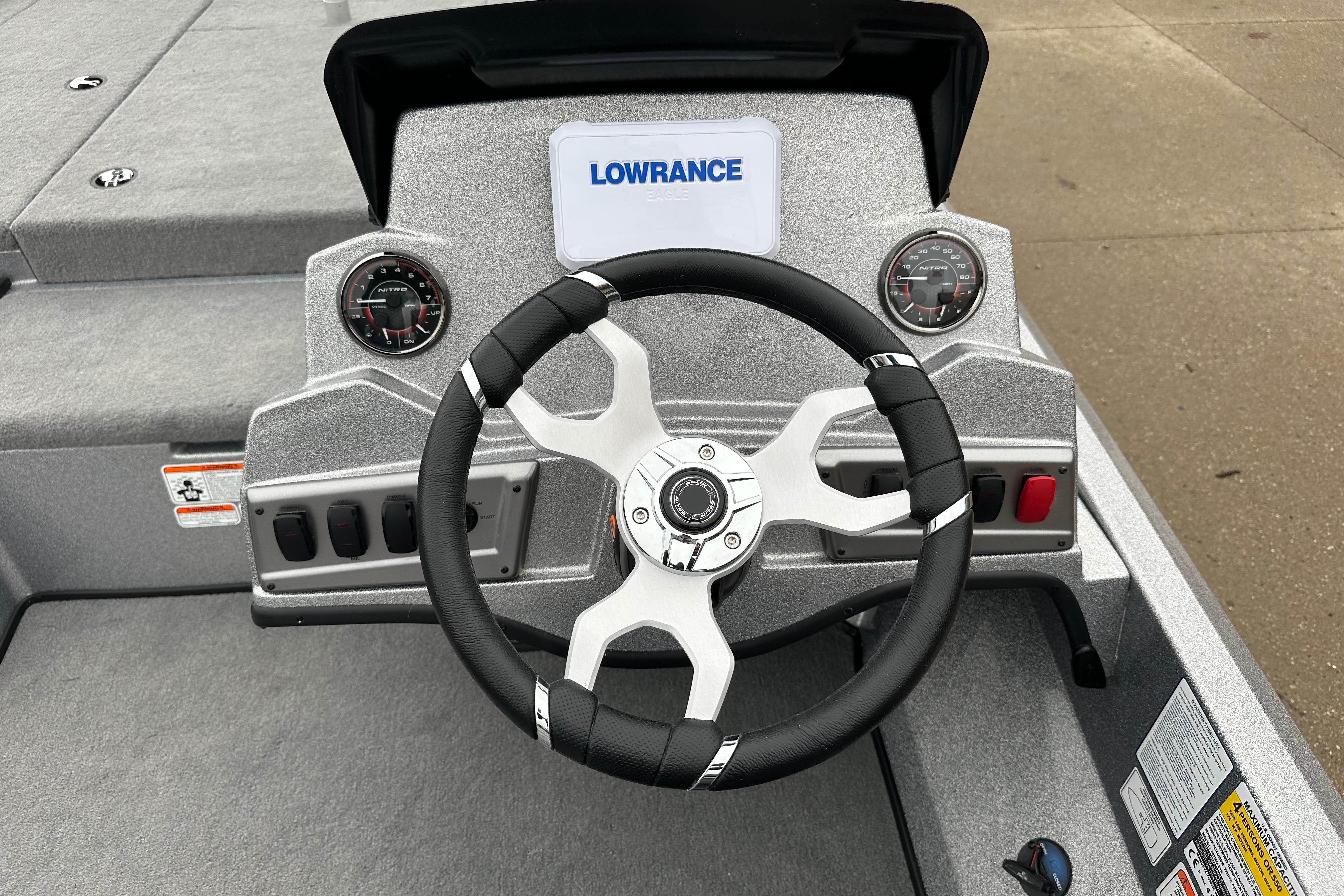 Steering console of 2026 Nitro Z18 boat with Lowrance display and gauges.