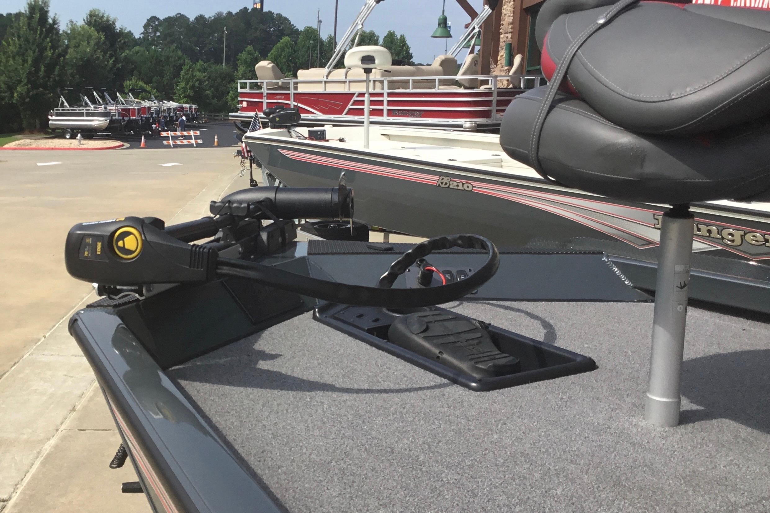 2025 Ranger RT178 boat deck with trolling motor and seat, parked near other boats.