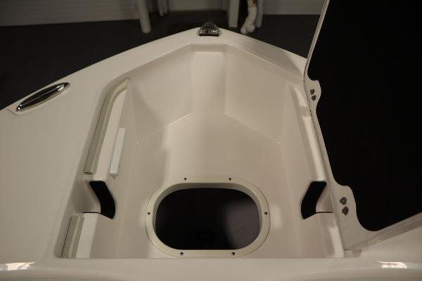 2025 Sea Fox 228 Commander boat storage compartment, open and empty.