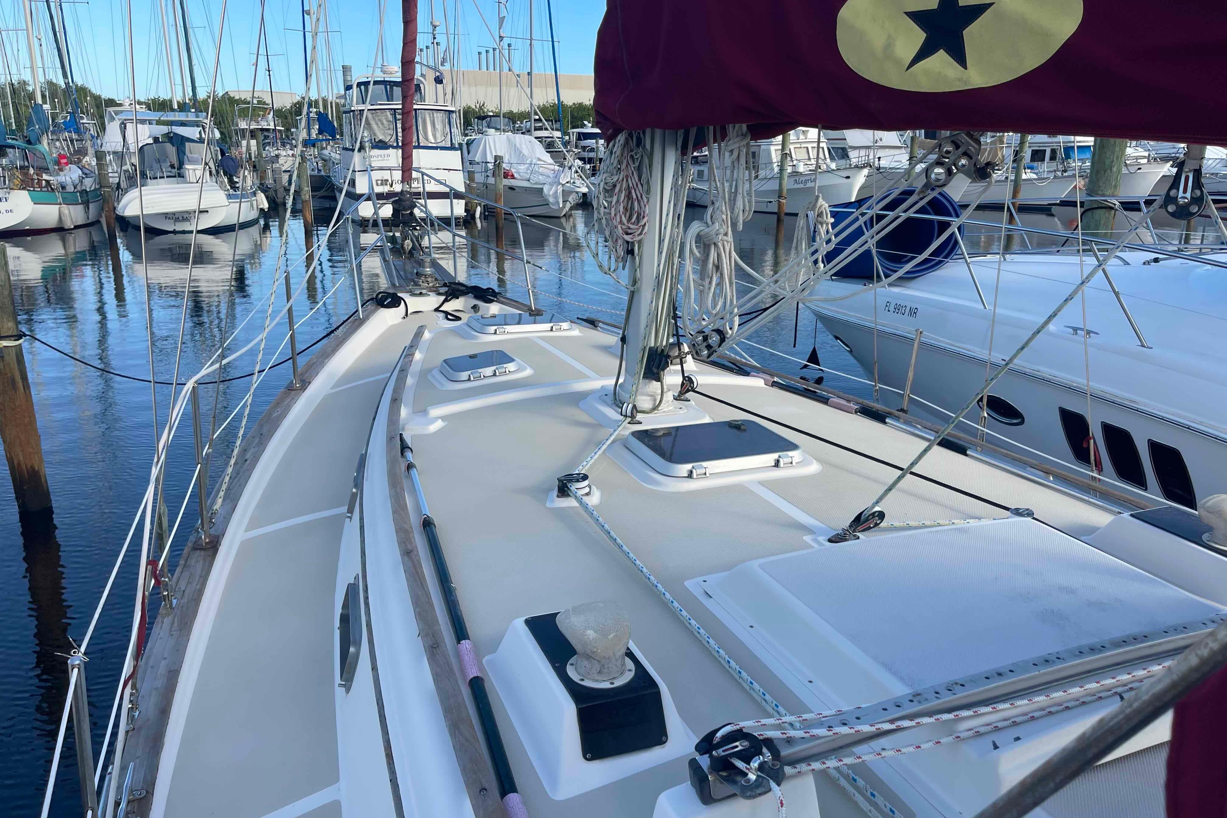 1989 Island Packet 35 sailboat docked in marina, showcasing deck and rigging.
