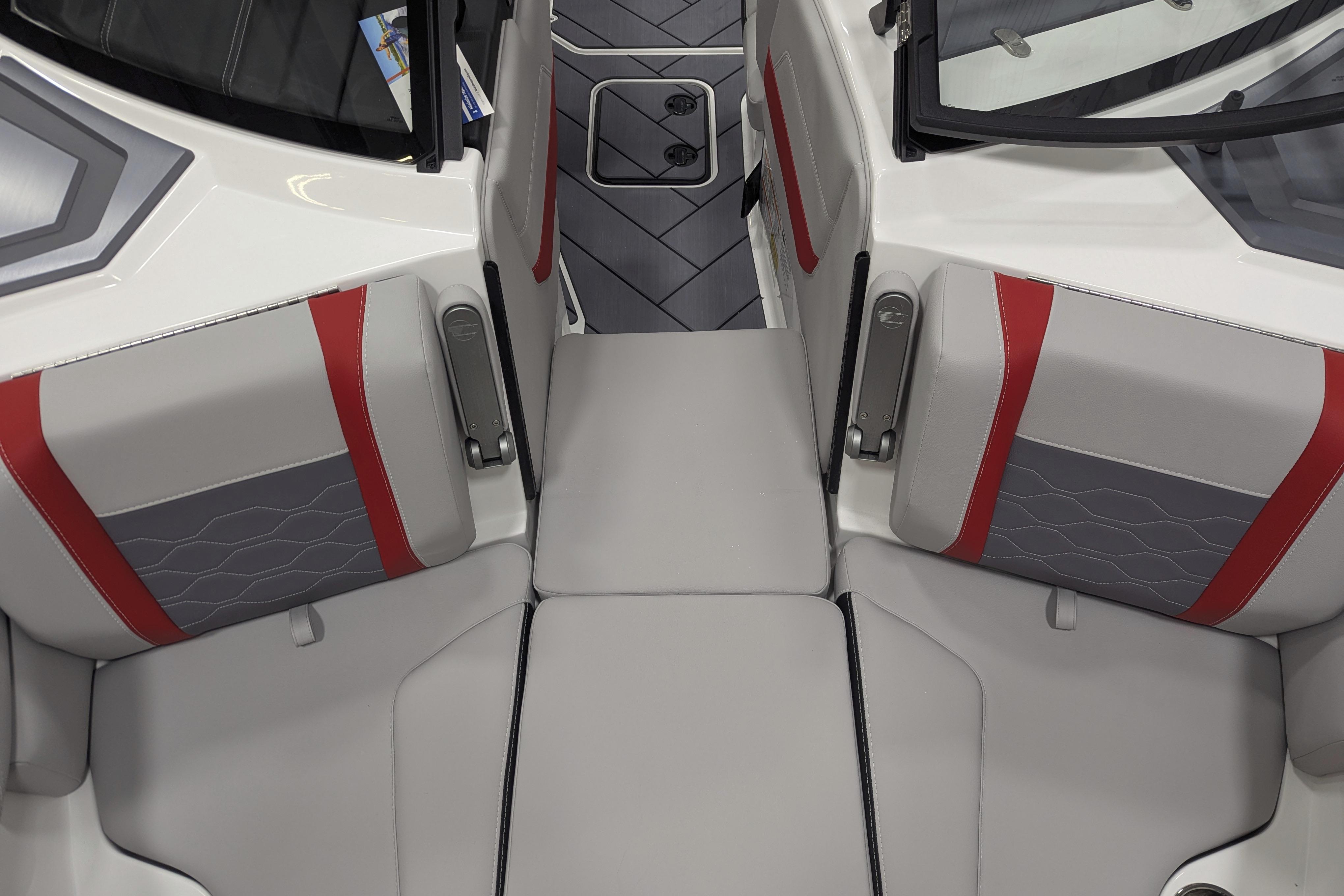 Interior of 2026 Malibu Wakesetter 23 LSV boat with gray and red seating.