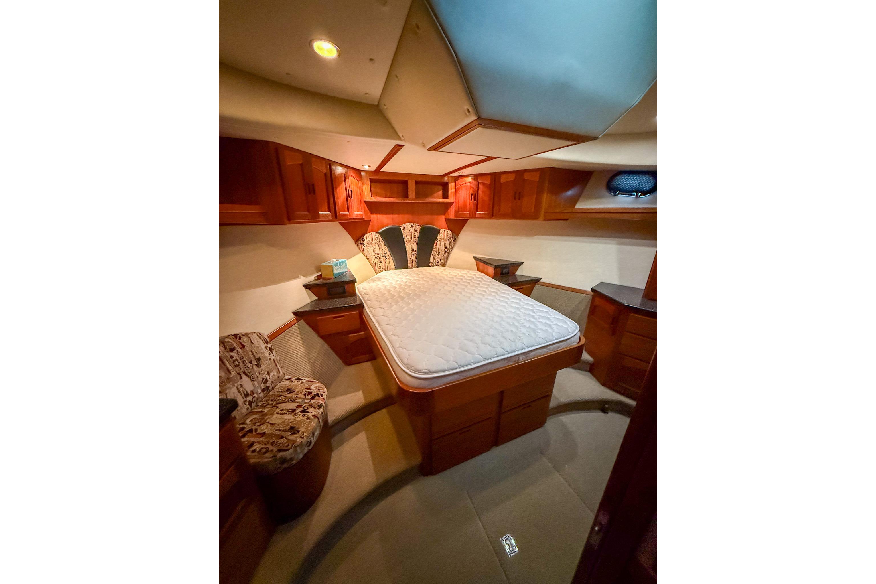 Luxurious cabin interior of 2007 Nordic Tug 54 with elegant wood finish.