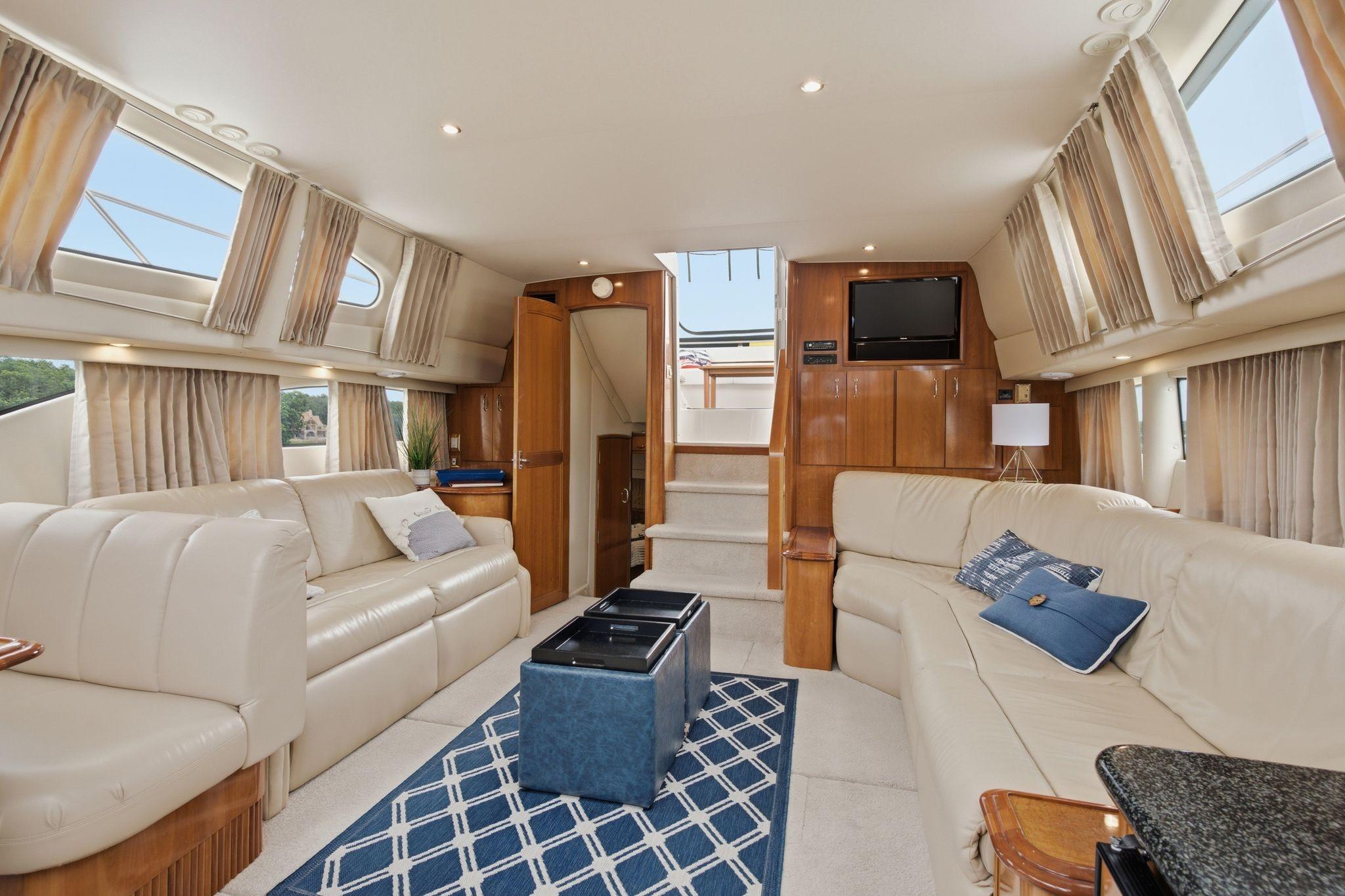 Luxurious interior of a 2005 Carver 39 Motor Yacht with plush seating and elegant decor.