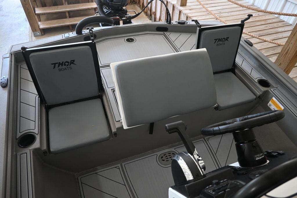 Interior of 2026 Thor Lake Hammer 1900CC boat with steering wheel and seating.