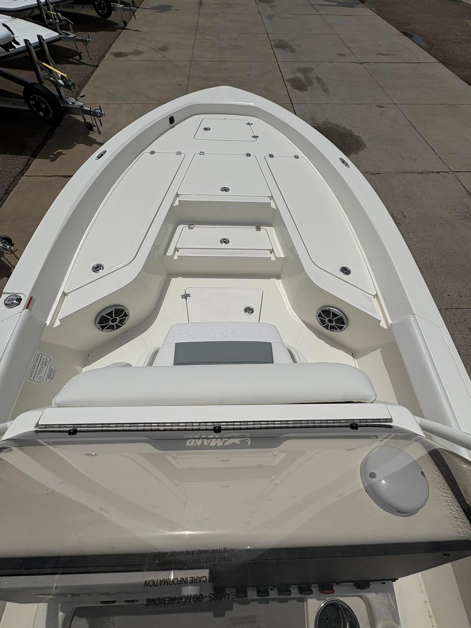 2025 Mako 24 APEX boat interior with seating and storage compartments.
