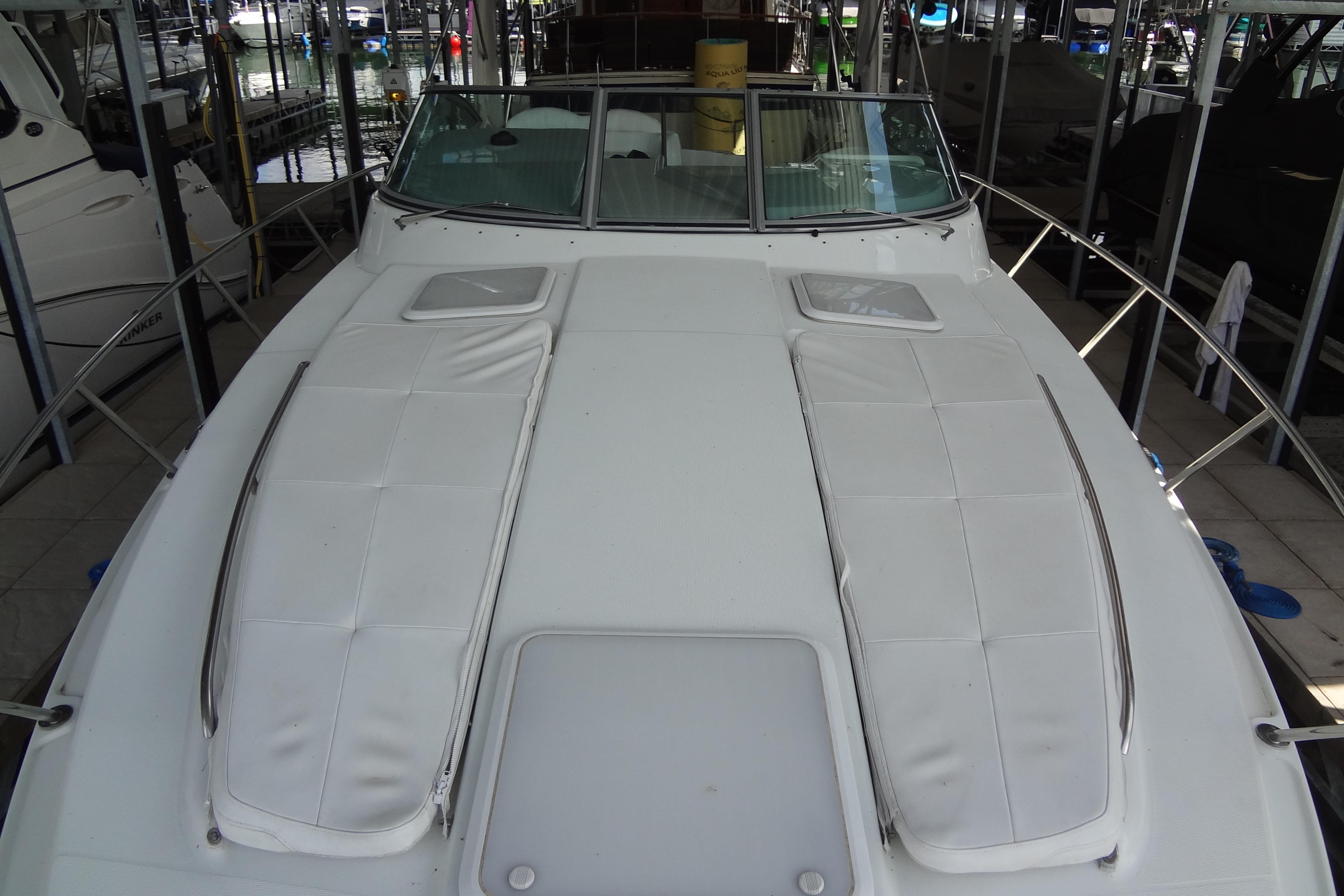2007 Formula 34 Performance Cruiser boat docked, showcasing spacious deck and sleek design.