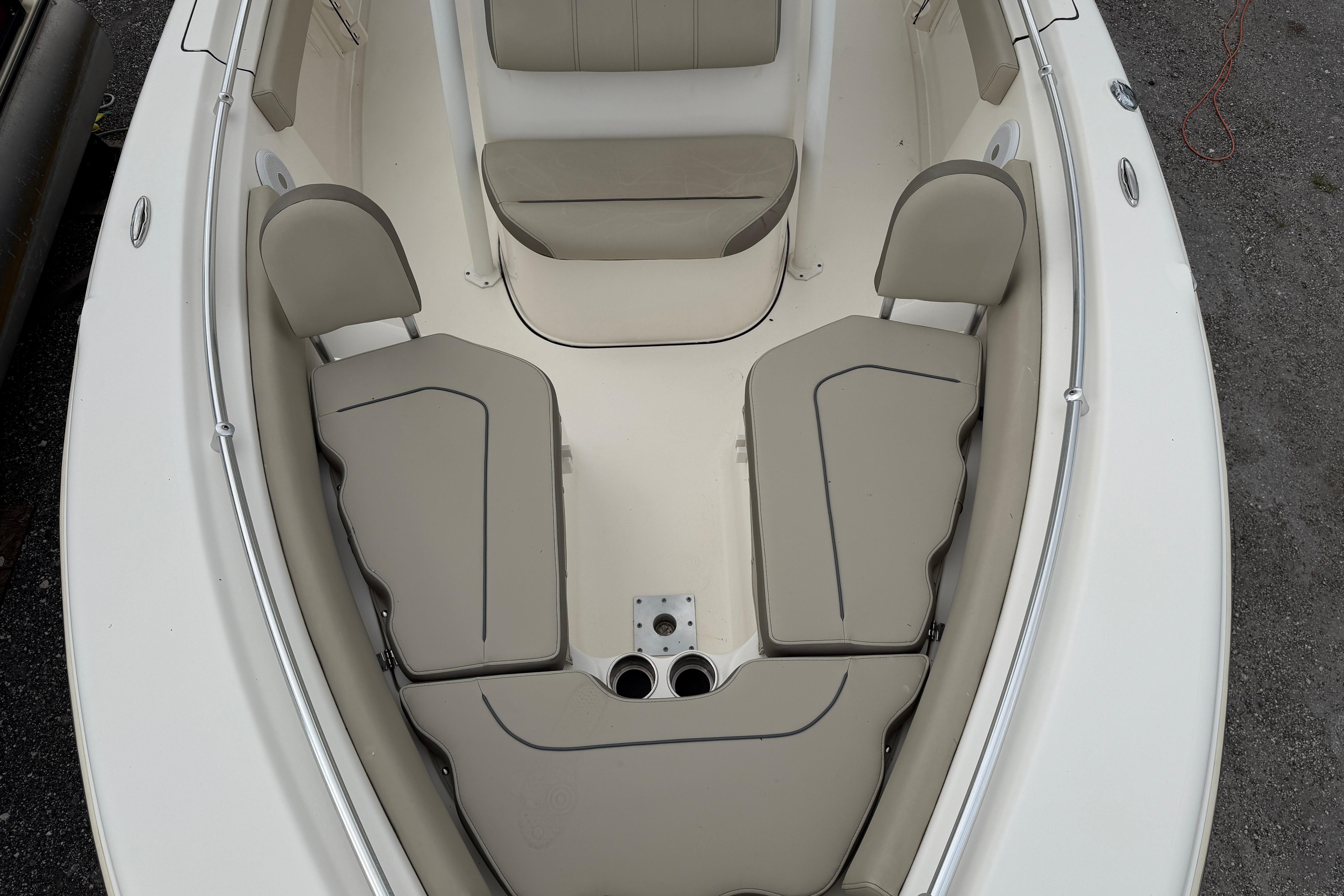 2022 Key West 219 FS boat interior with beige seating and cup holders.
