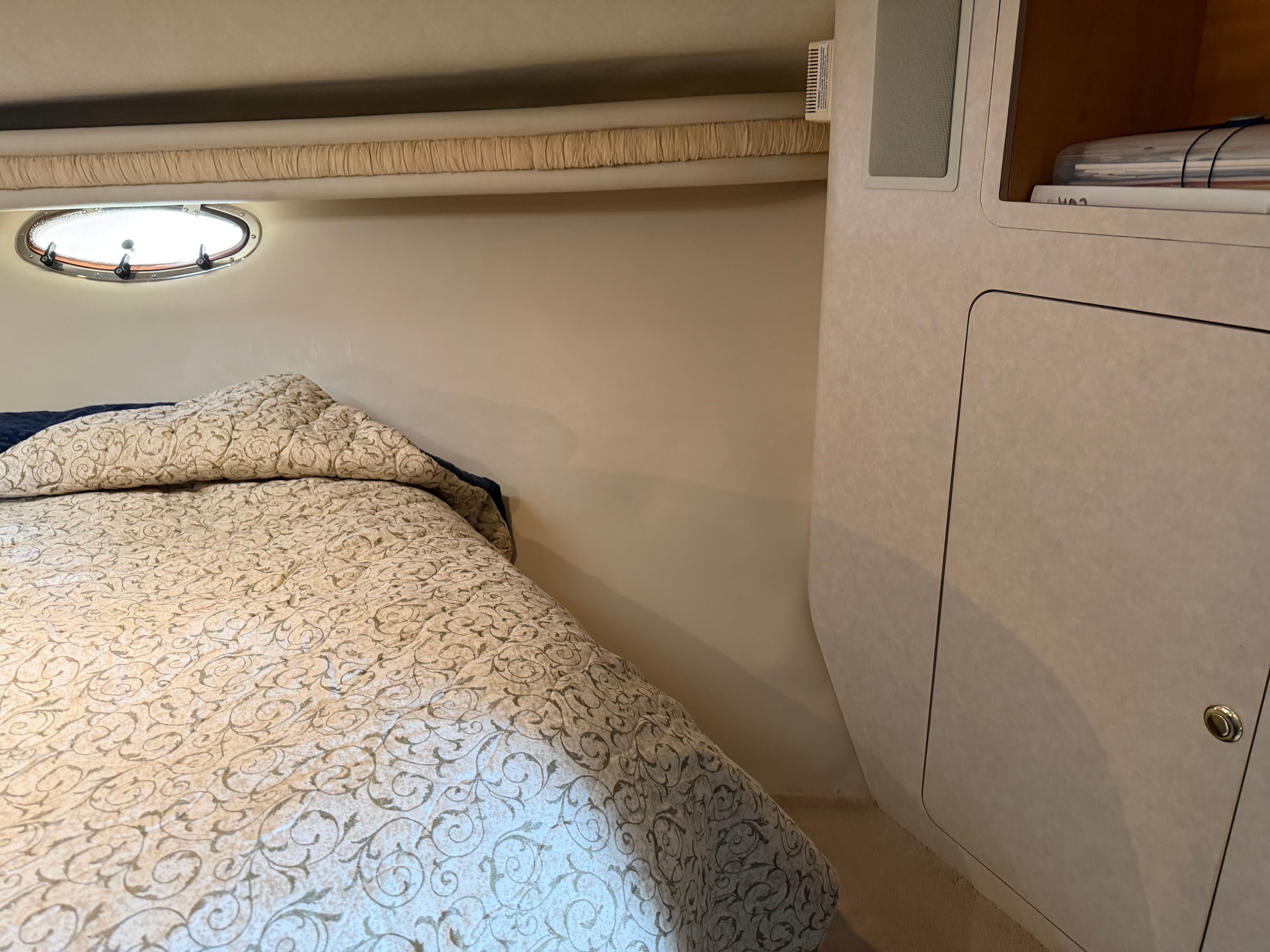 Interior of a 1997 Regal Commodore with bed and window.