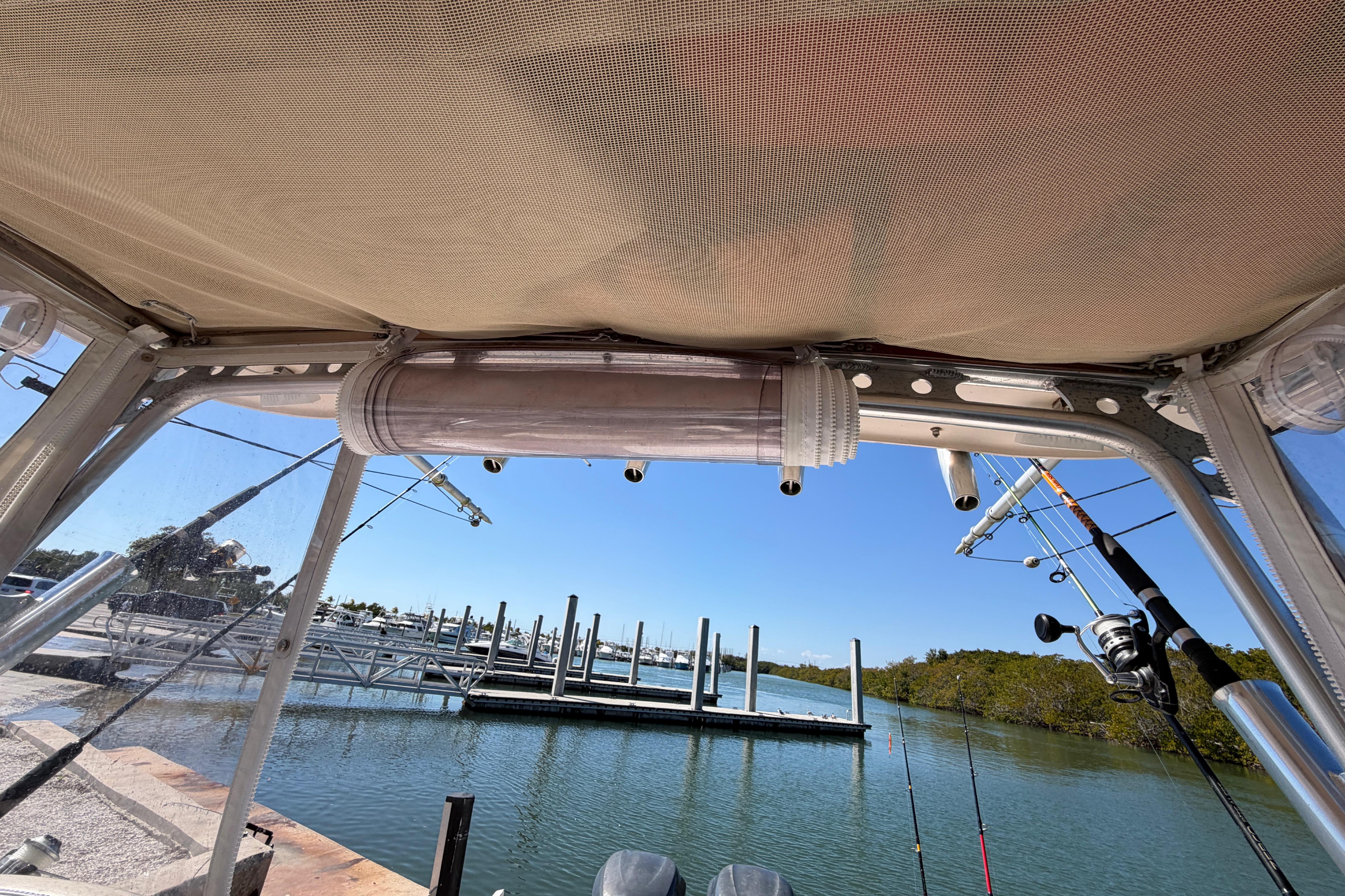 2006 Grady-White Sailfish 282 boat interior with fishing rods, docked at marina.