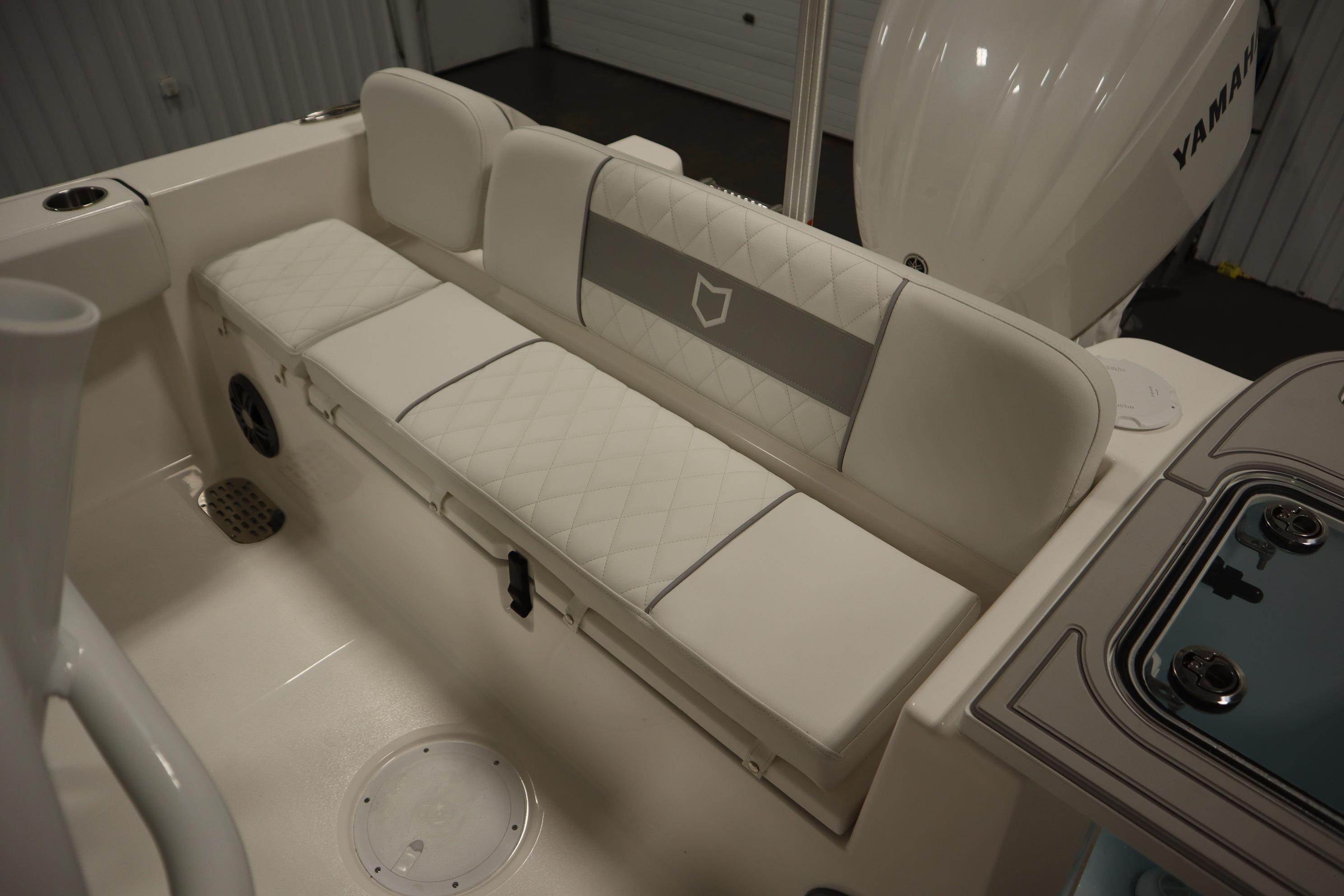 2026 Sea Fox 228 Commander boat interior with cushioned seating and Yamaha engine.