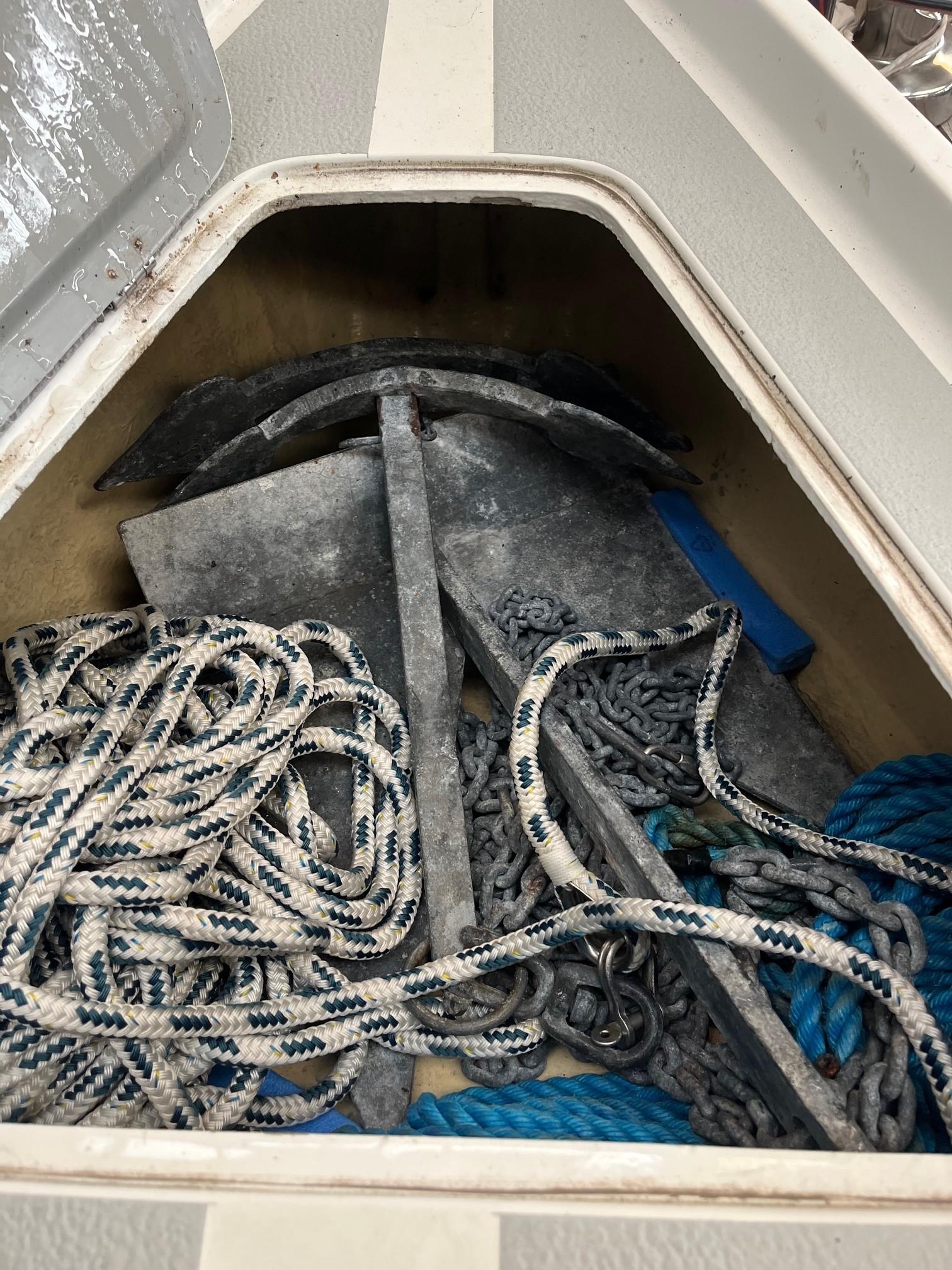 Anchor and ropes in storage compartment of 1980 LM 32 boat.