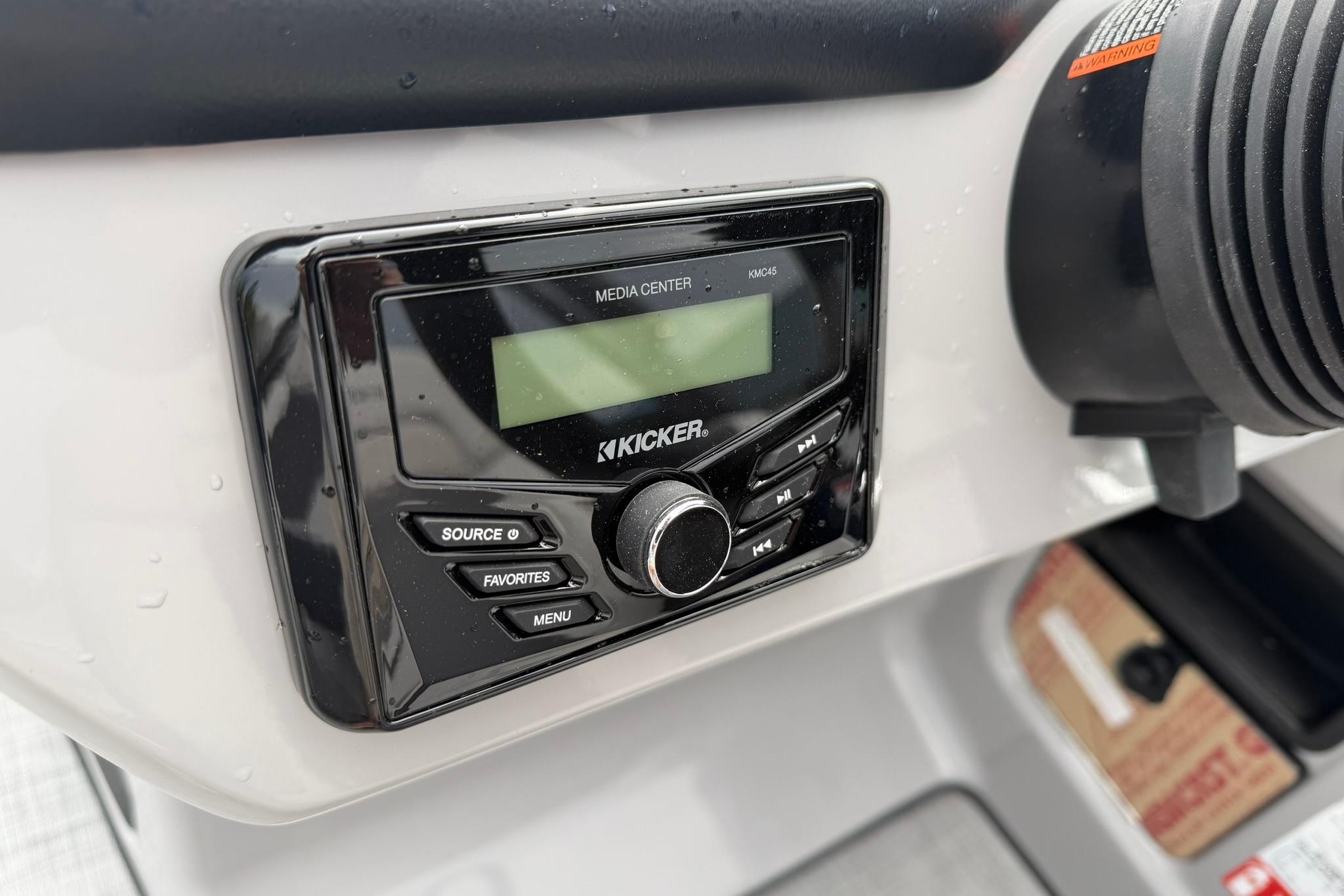 Kicker media center in 2026 Lowe LS 190 boat dashboard, featuring control buttons.