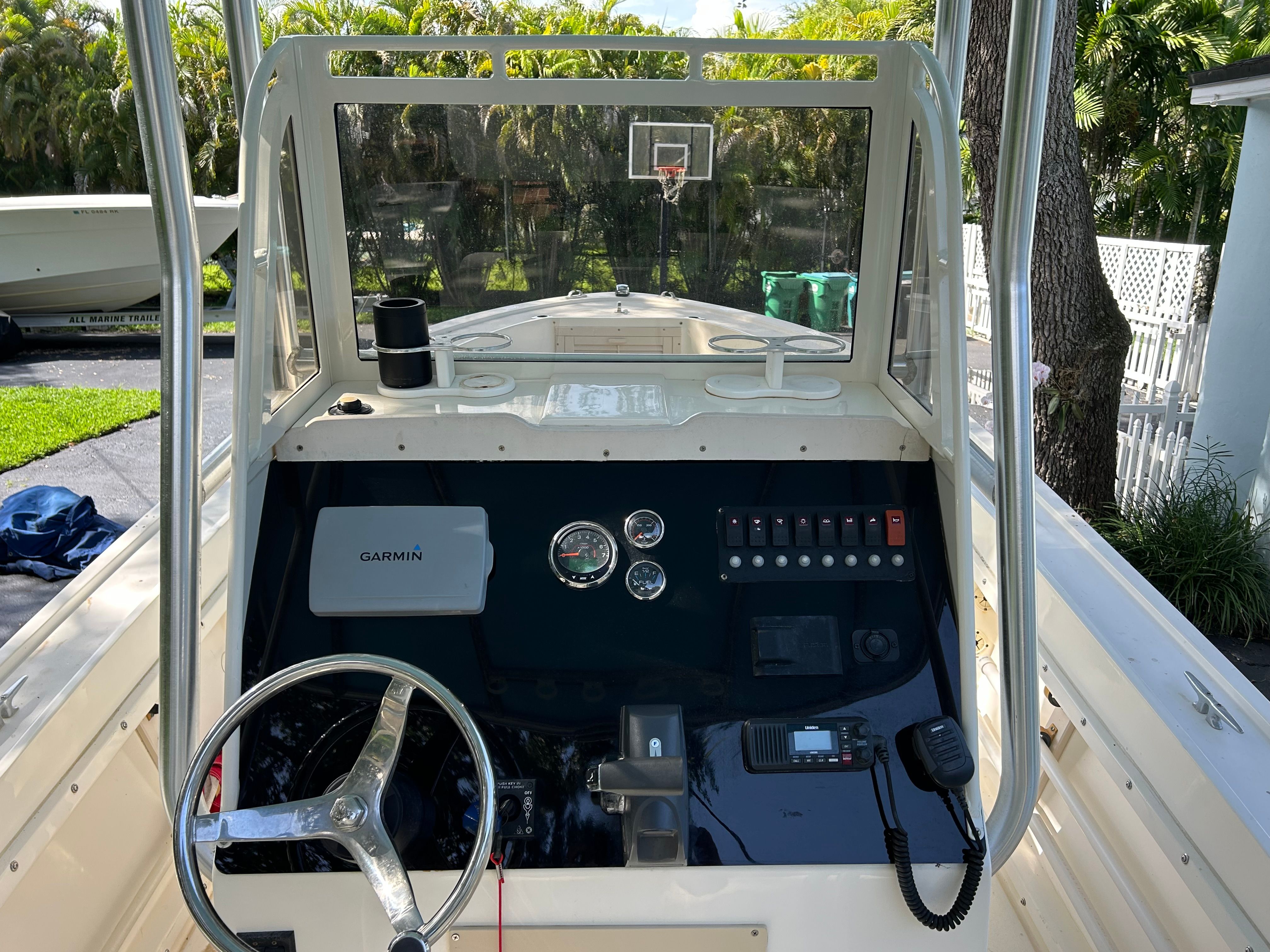 Interior view of a 1992 Mako 221 boat with control console.