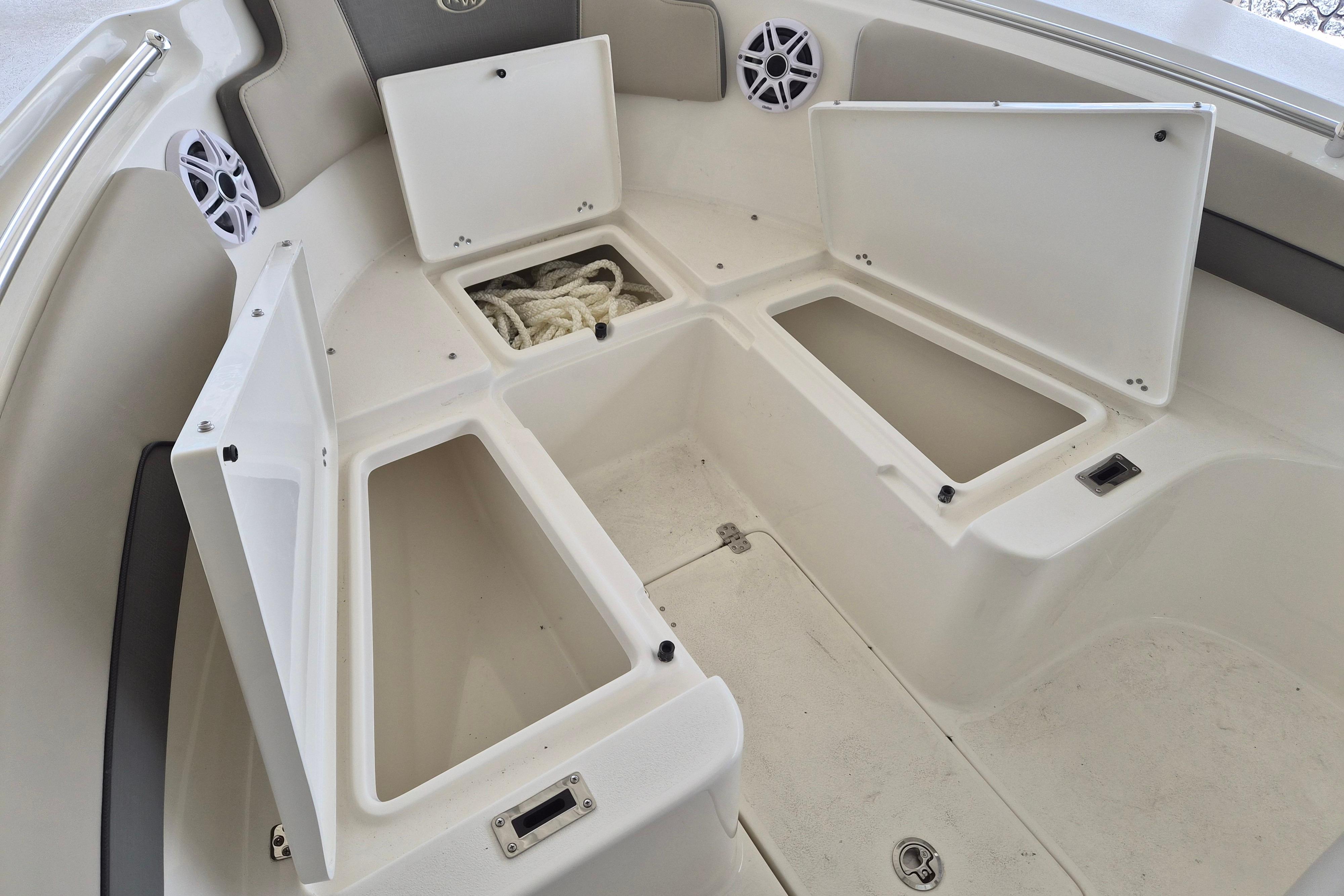Open storage compartments on a 2026 Key West 260 Center Console boat.