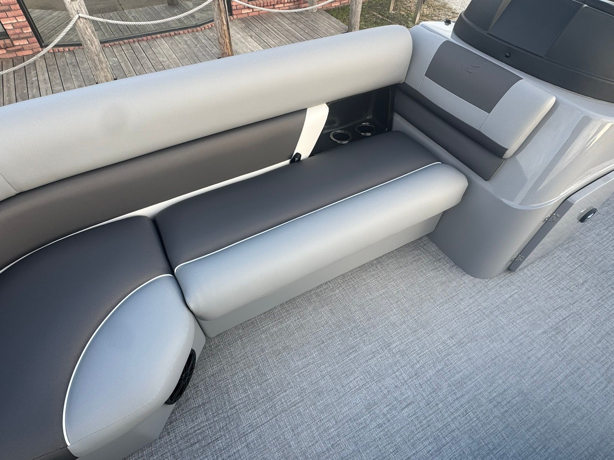 Interior of 2026 Landau 23 Island Breeze with gray upholstery.