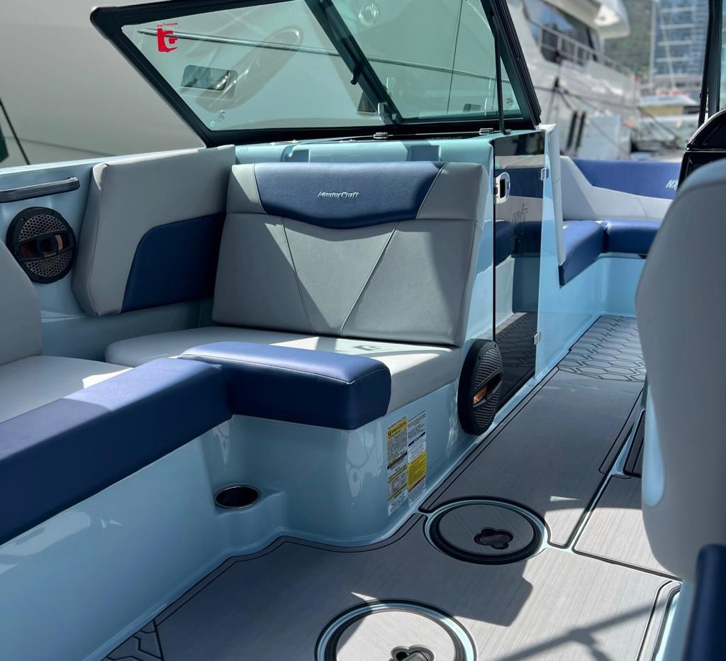 2023 MasterCraft NXT22 boat interior with blue and gray seating, modern design.