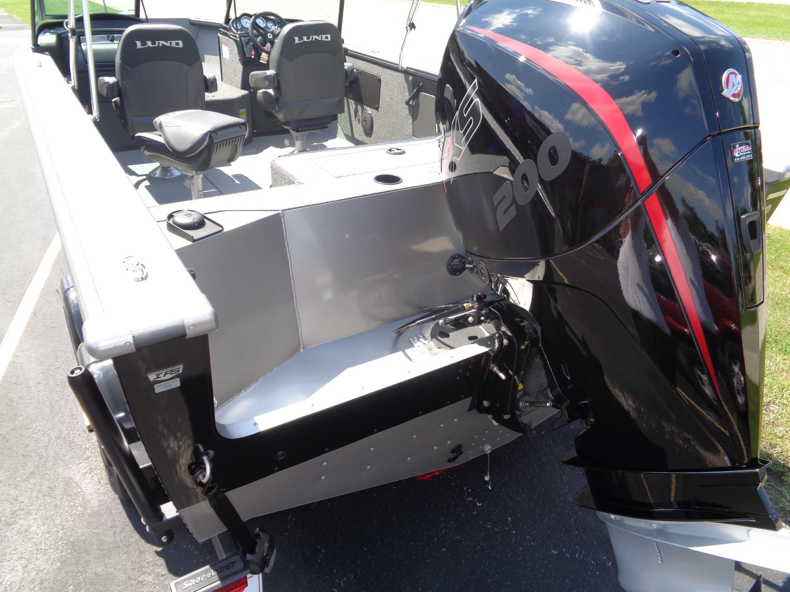 2025 Lund 2075 Fisherman boat with powerful outboard motor and spacious seating.