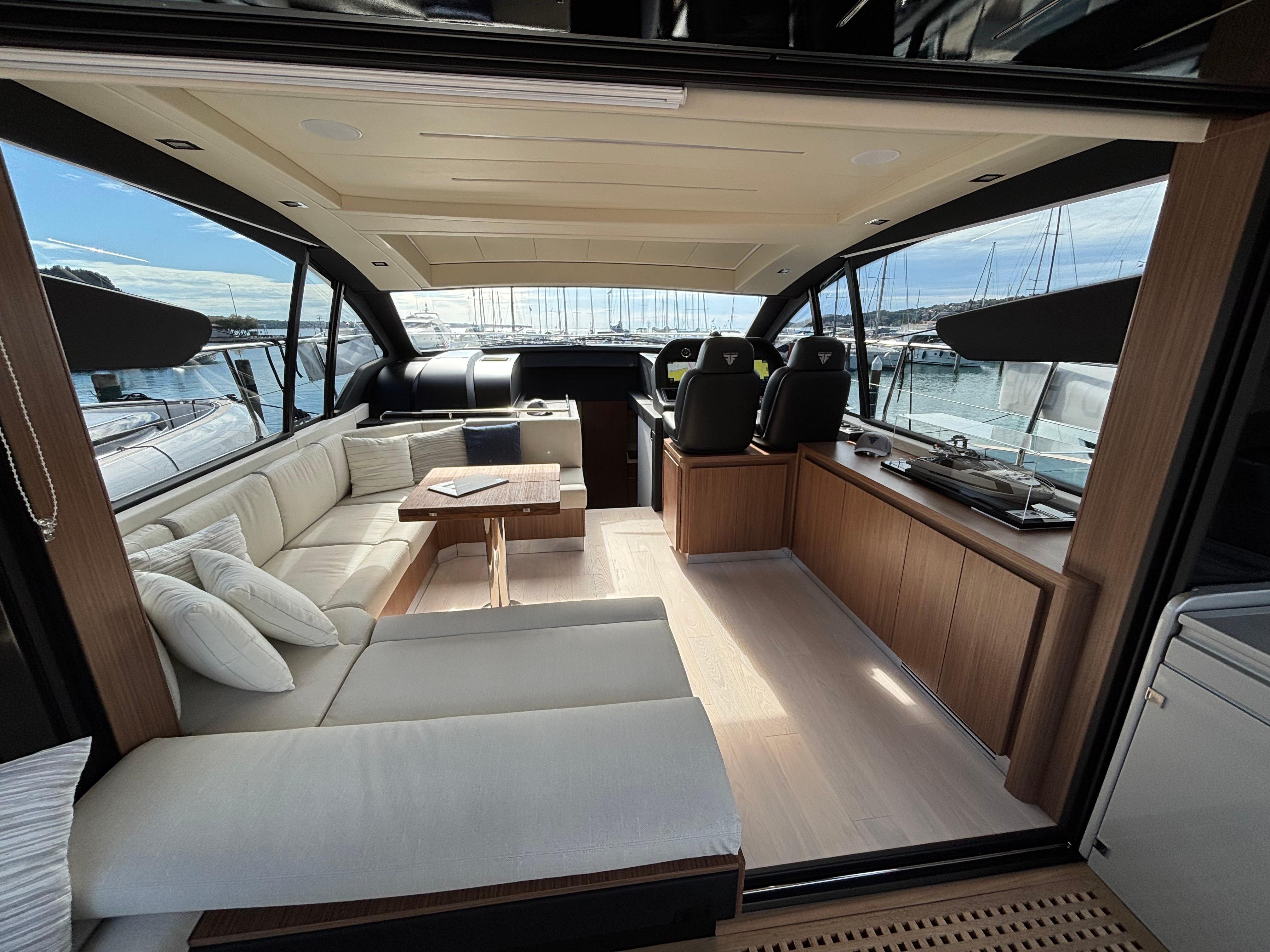 Luxurious interior of 2025 Filippetti S55 yacht with elegant seating and panoramic views.