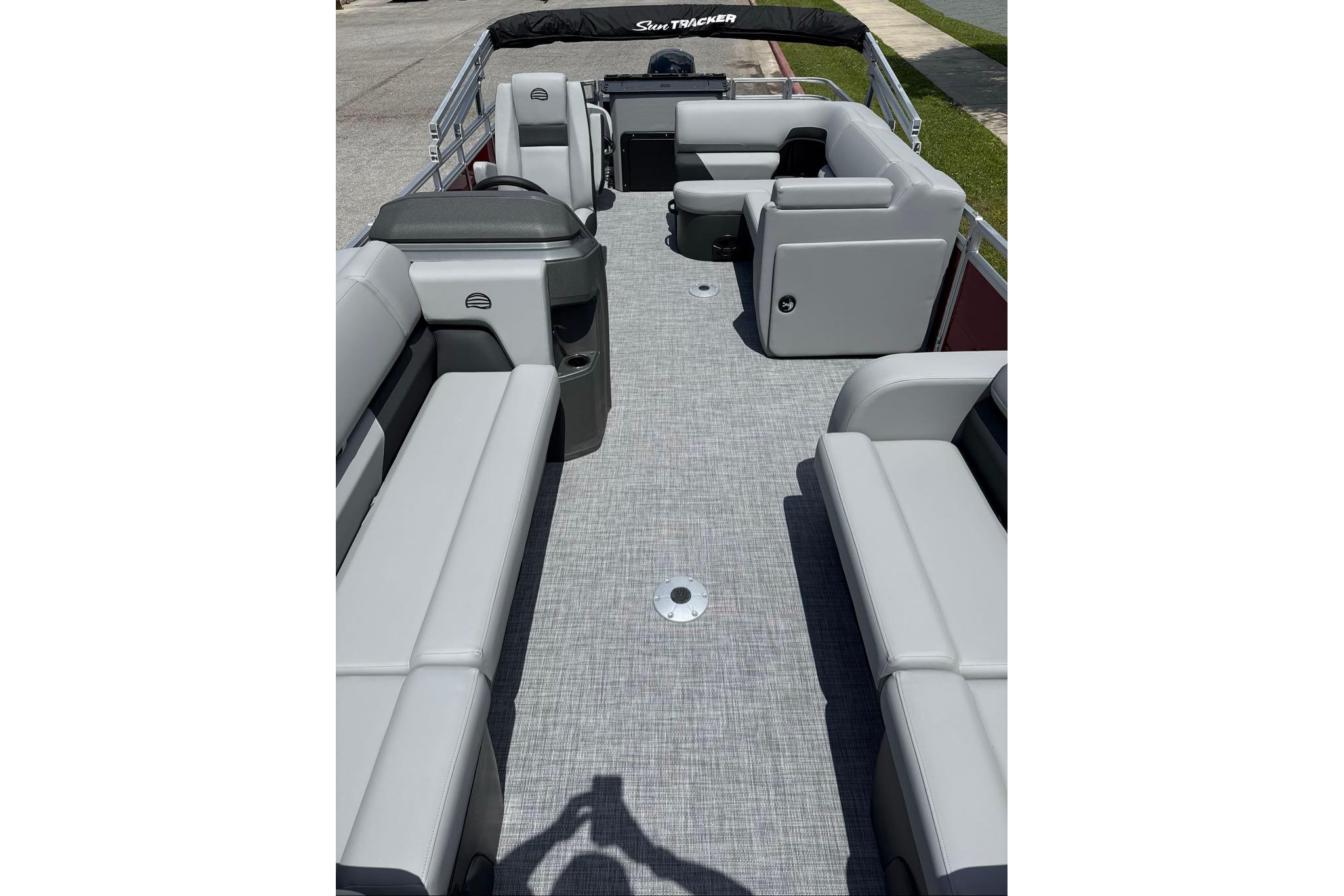 2026 Sun Tracker SportFish 22 DLX pontoon boat interior with spacious seating and modern design.