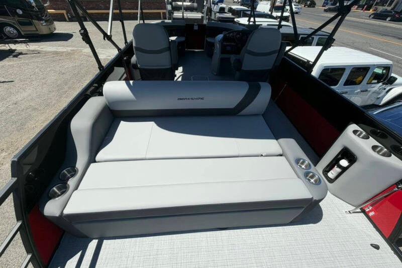 2026 Berkshire LE 24' Ultra Lounger boat interior with gray seating and cup holders.