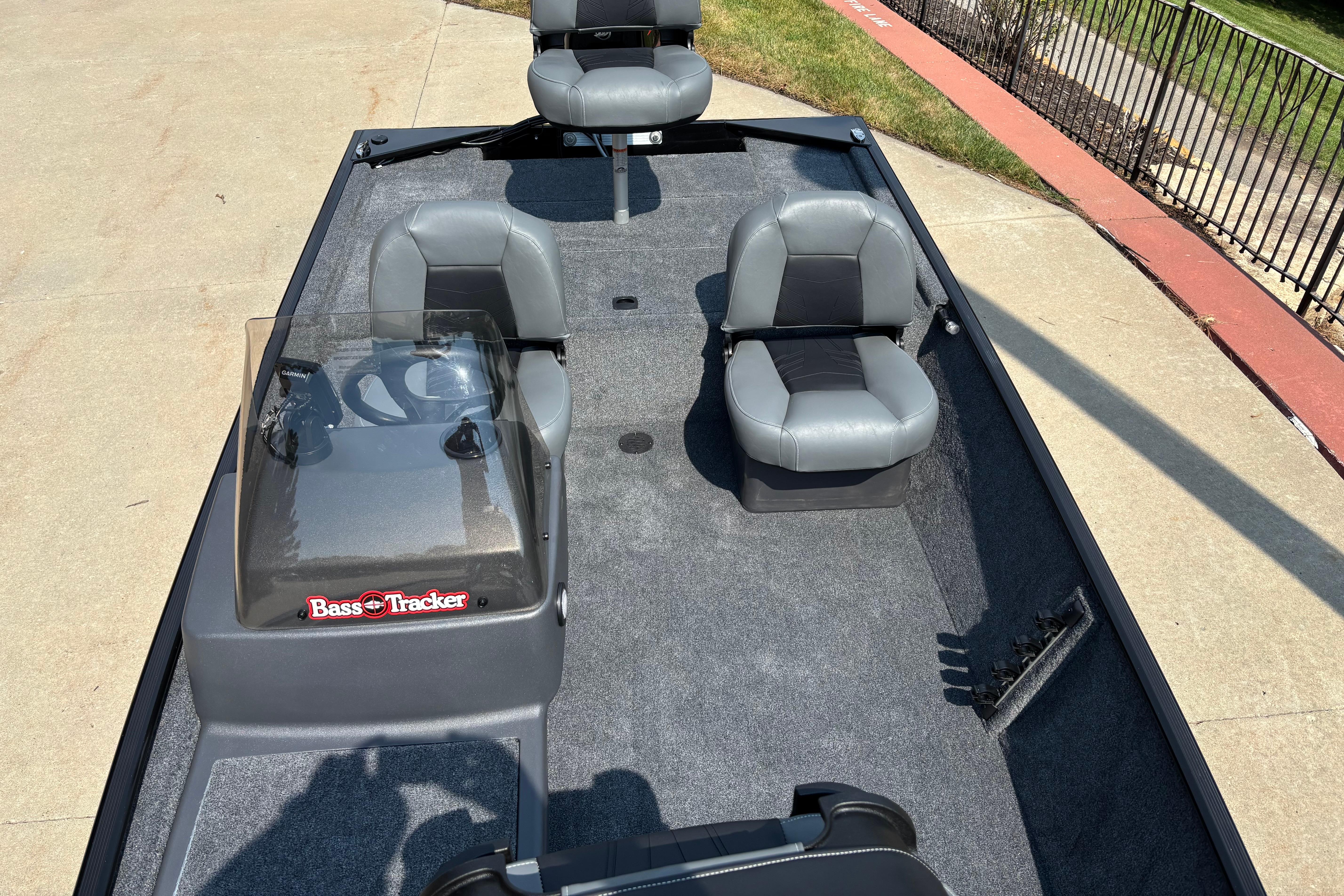 2026 Tracker Bass Tracker Classic XL boat with gray seating and console on a sunny day.