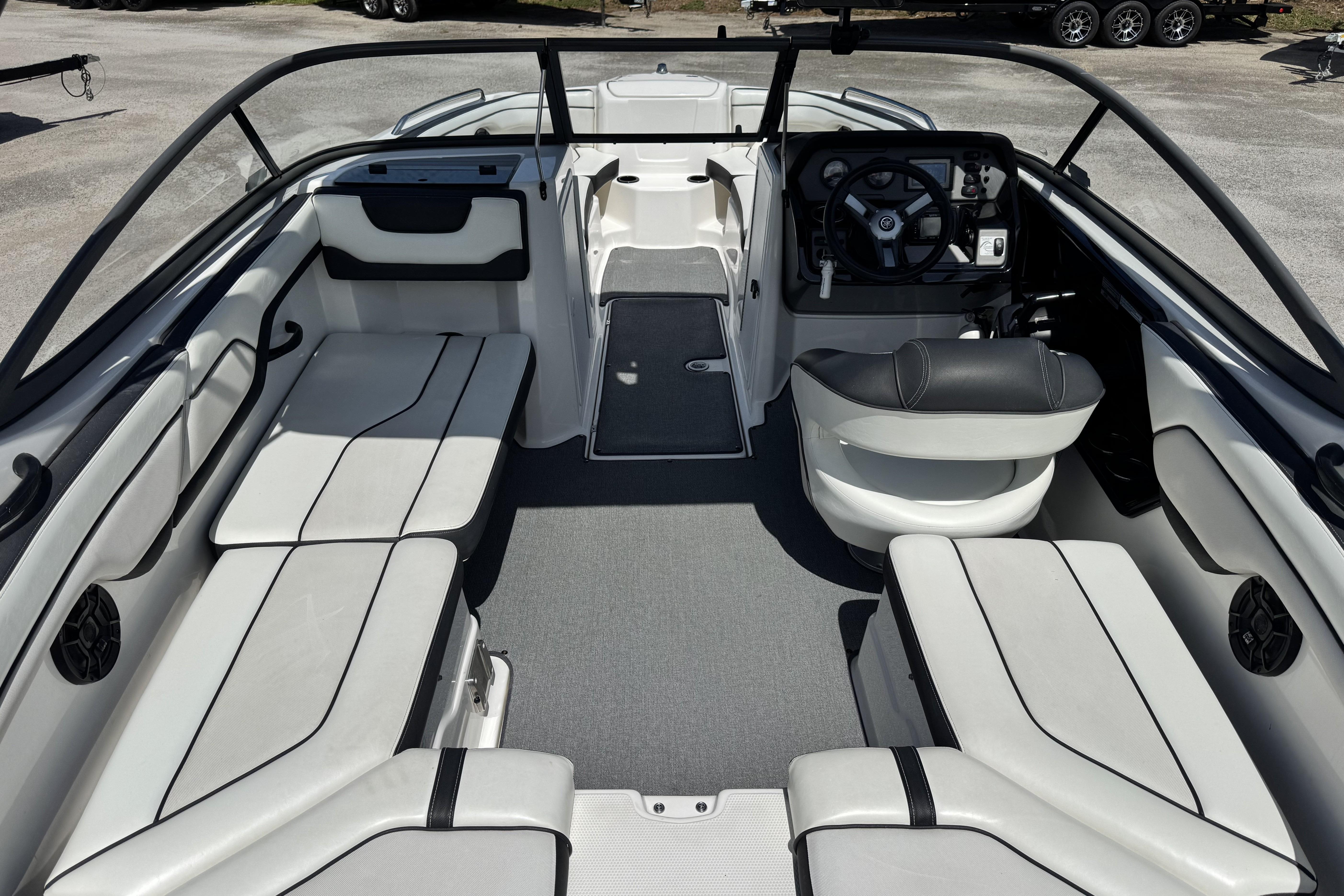 2018 Yamaha Boats AR210 interior with sleek seating and modern dashboard design.