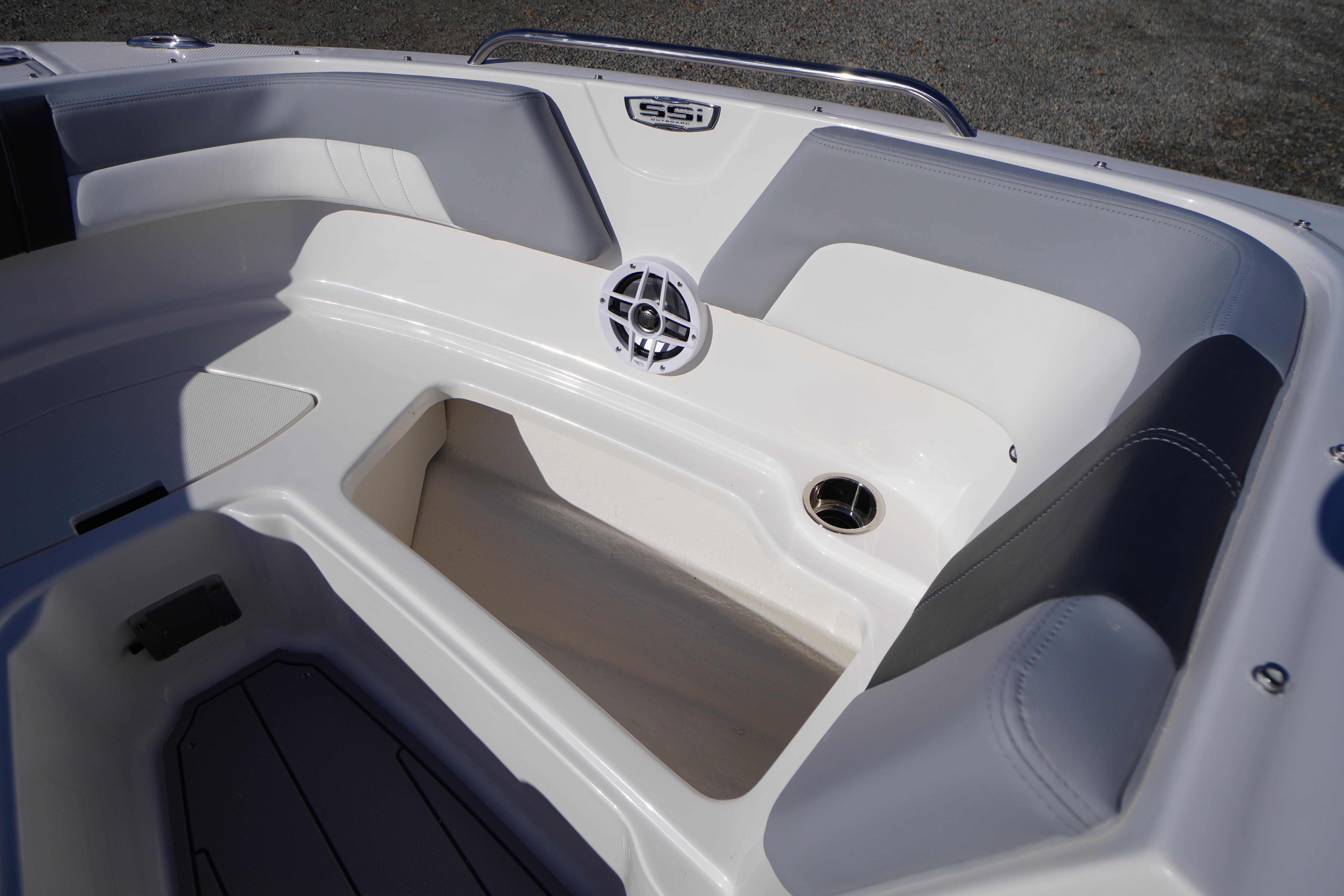 Interior view of 2026 Chaparral 23 SSi OB boat, featuring seating and speaker.