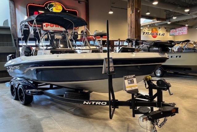 2023 Nitro ZV20 Pro boat on display in showroom with trailer.
