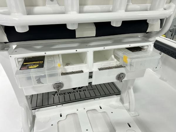 Tidewater 2300 Carolina Bay 2025 boat storage compartments with tackle boxes.