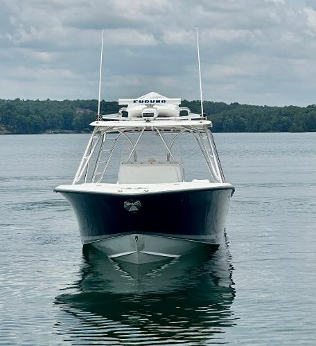 2008 SeaVee 390B boat on calm water, front view, under cloudy sky.